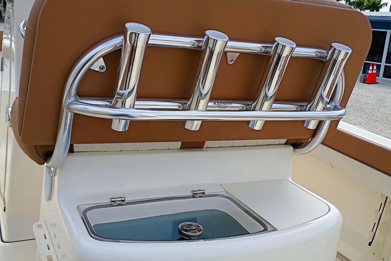 2026 Pioneer 202 Sportfish boat with rod holders and livewell.