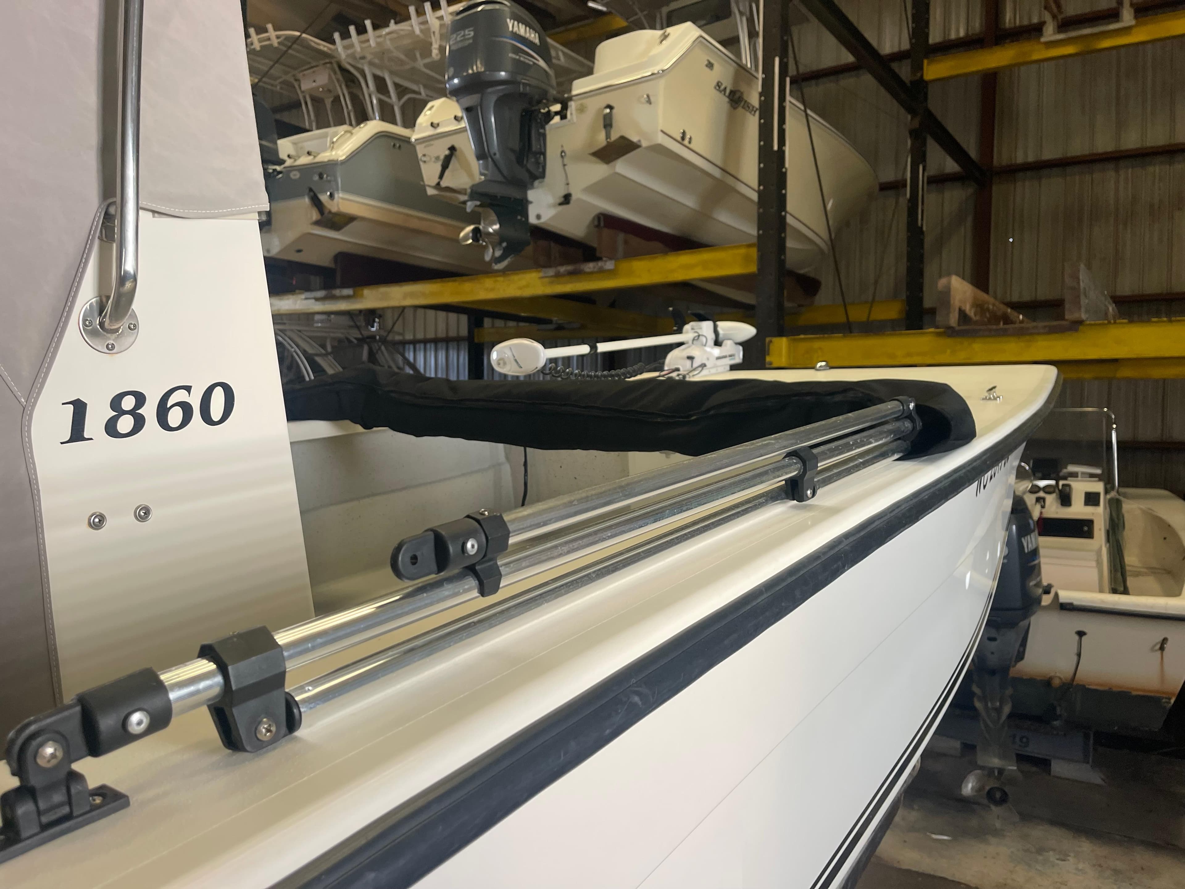 2013 KenCraft Bay Rider 1860 boat in storage, showcasing side view and equipment.