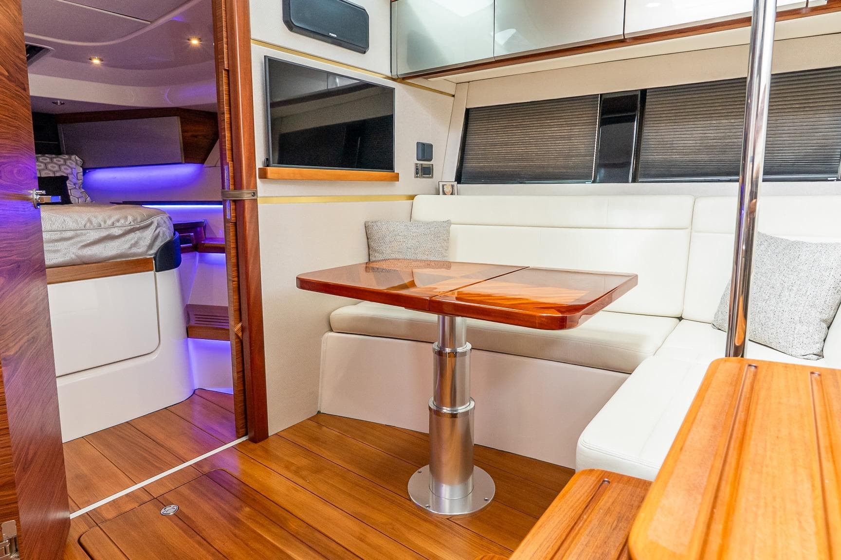 2024 Boston Whaler 405 Conquest interior with elegant seating and wooden table.