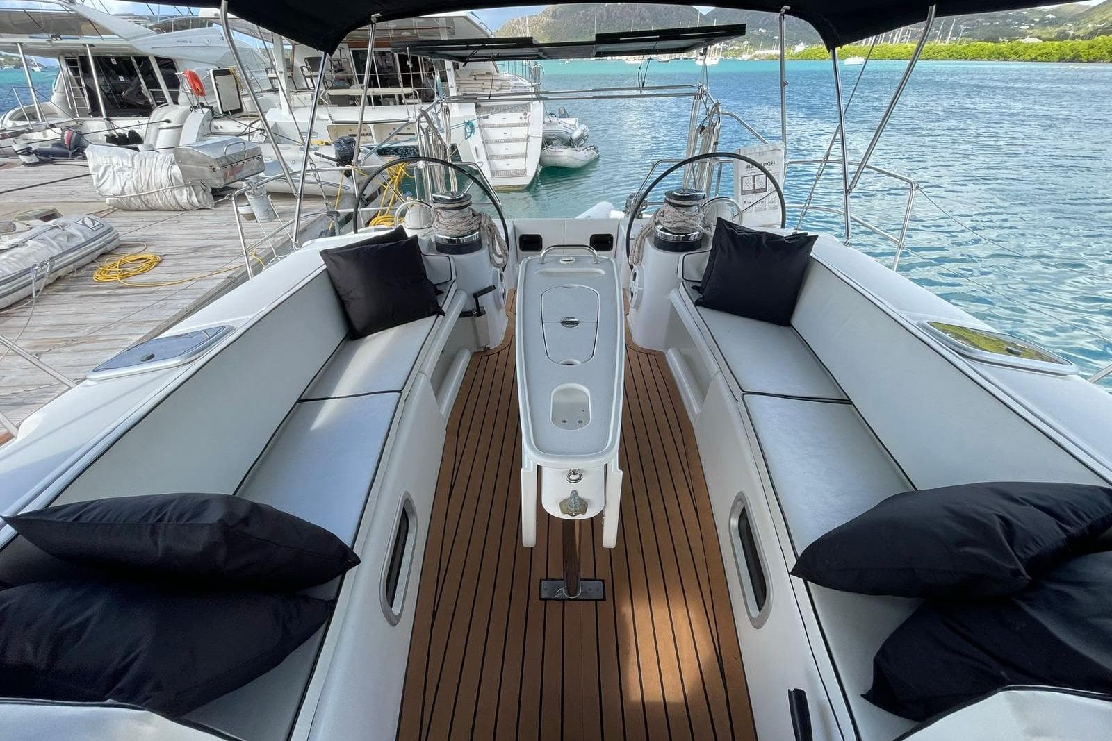 Luxurious 2006 Beneteau Oceanis Clipper 523 yacht interior with elegant seating and teak flooring.