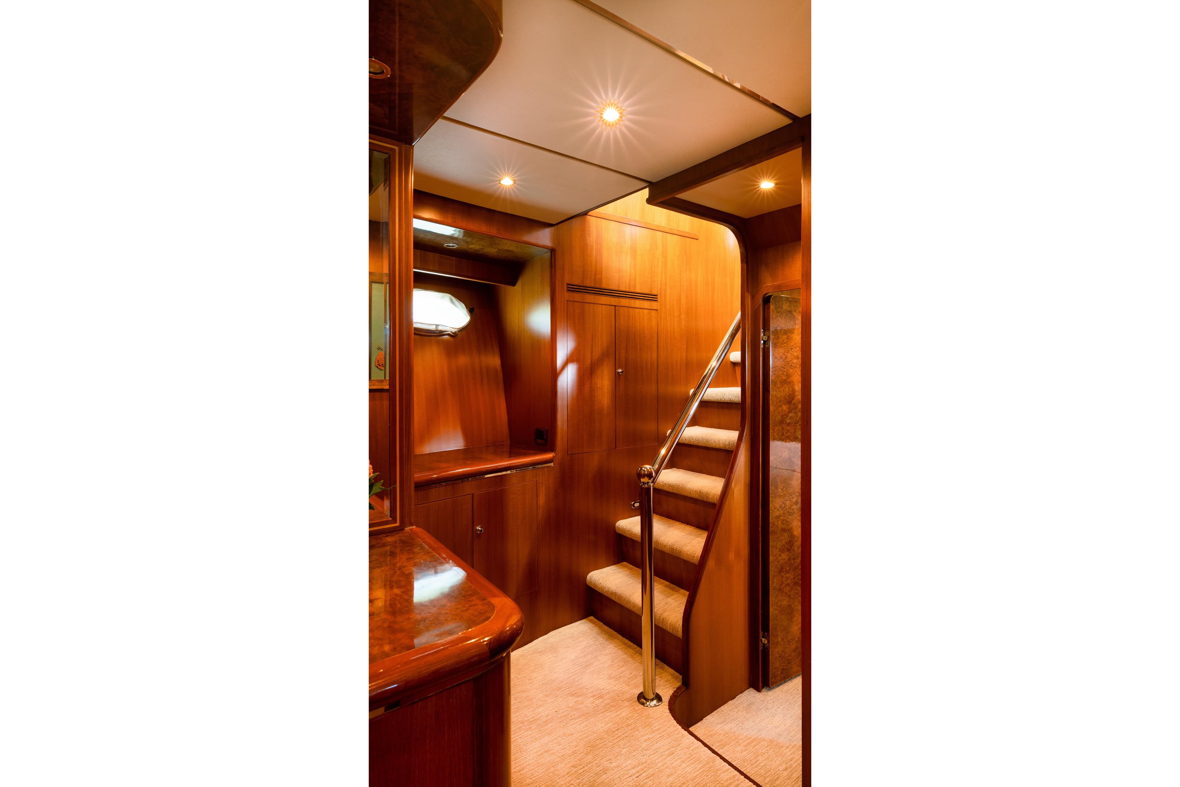 Luxurious wooden interior of 2003 Ocean Alexander 700 Classicco yacht staircase.