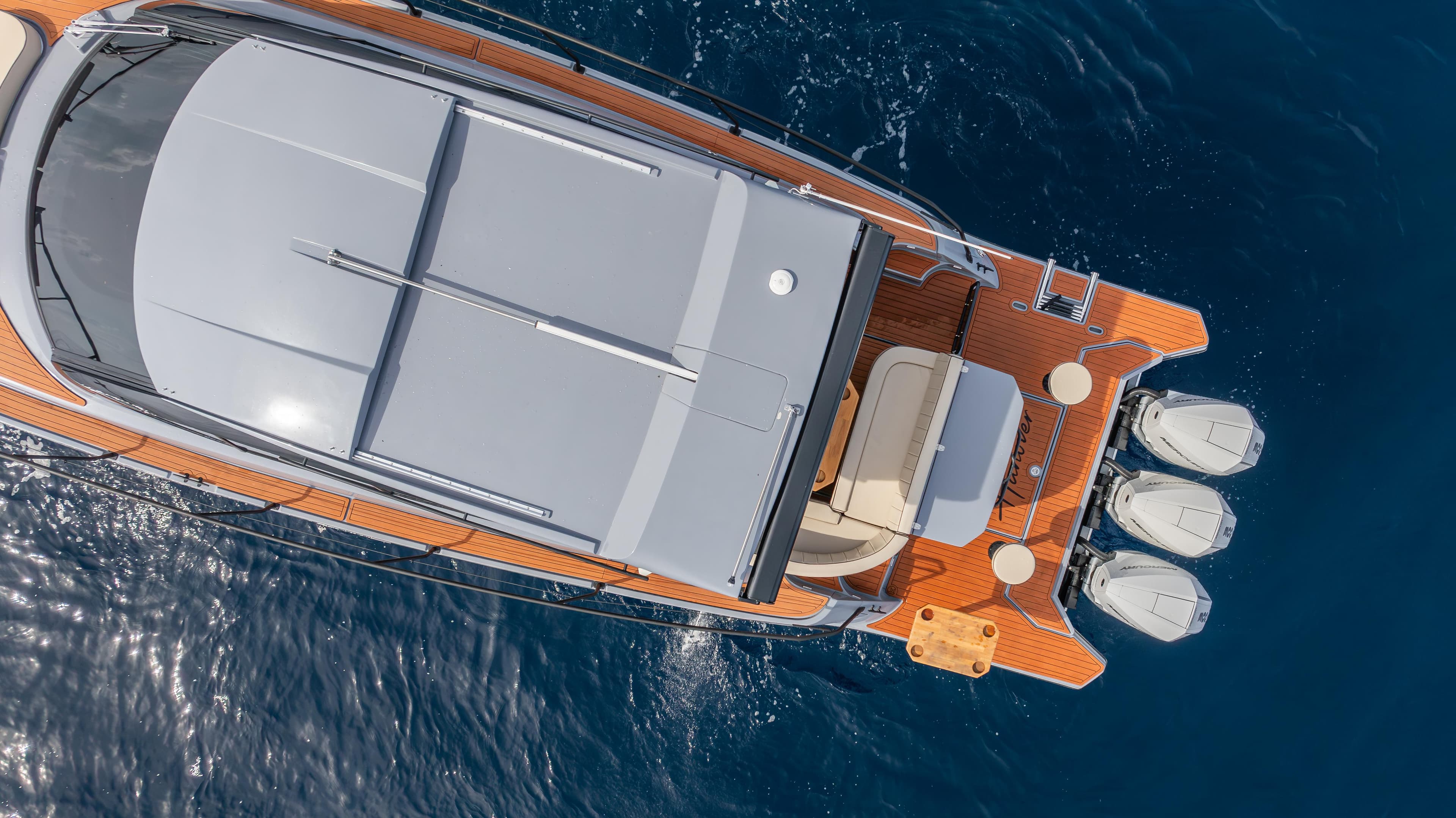 Aerial view of 2025 Hanover 415 yacht on blue ocean water.