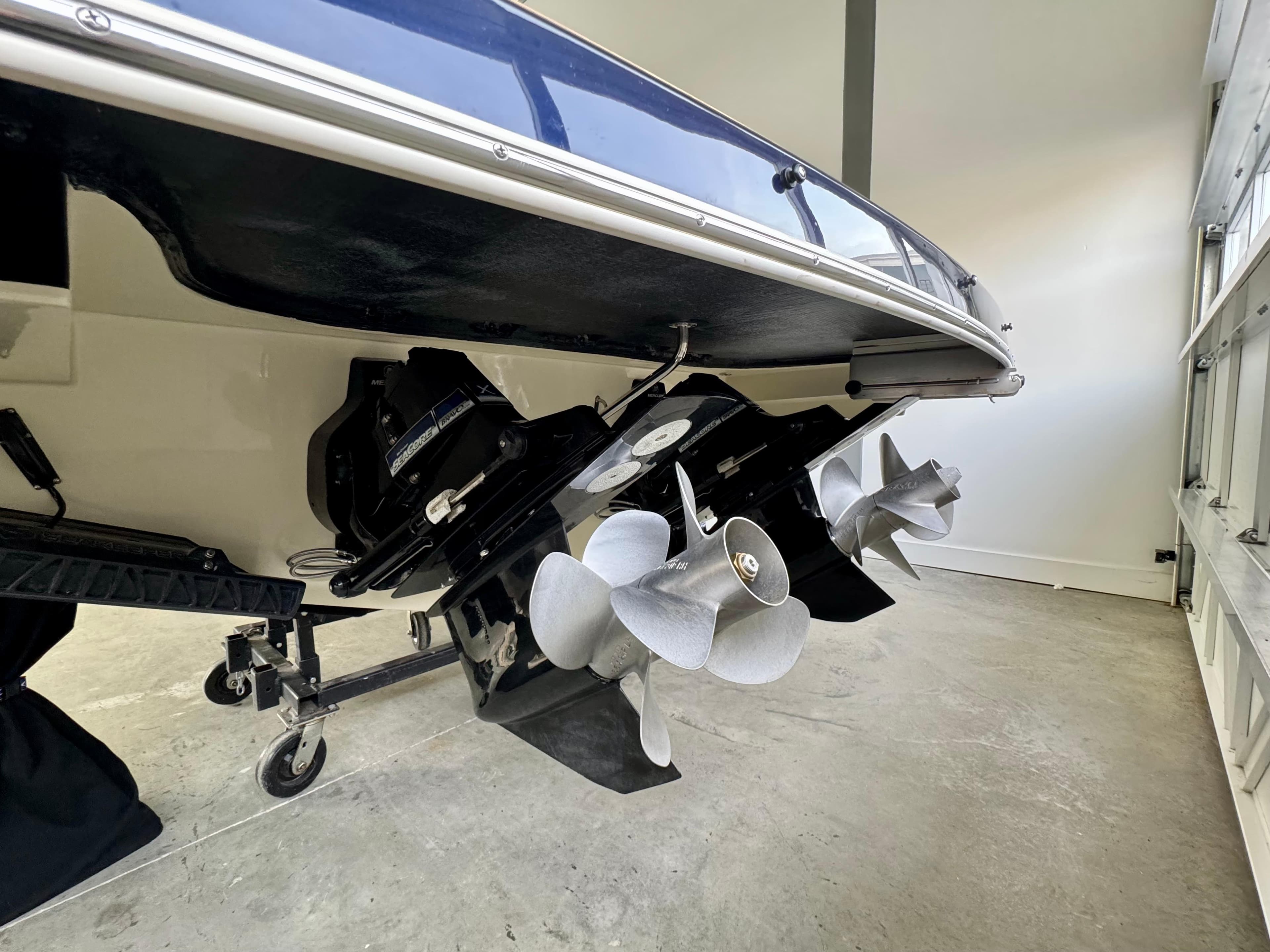 2024 Chris-Craft Launch 35 GT boat propellers in a garage setting.
