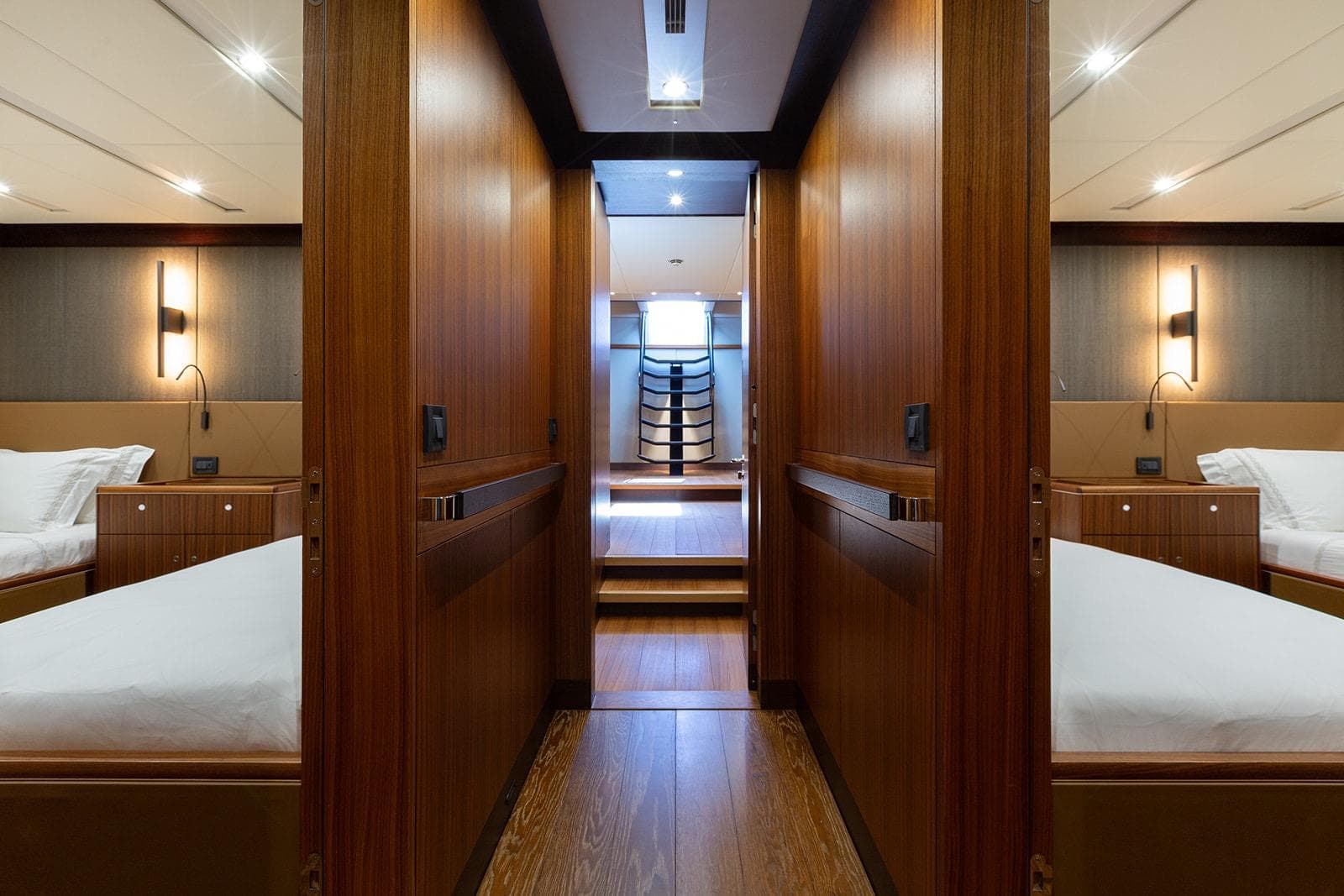 Luxurious interior of 2015 Royal Huisman 142 yacht, featuring elegant wood paneling and modern lighting.