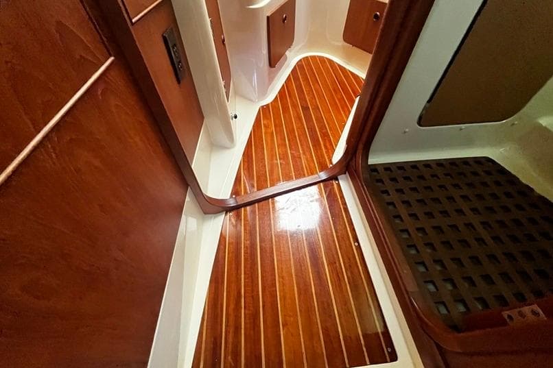 Interior of 1980 CS 36 Traditional sailboat with polished wooden flooring.