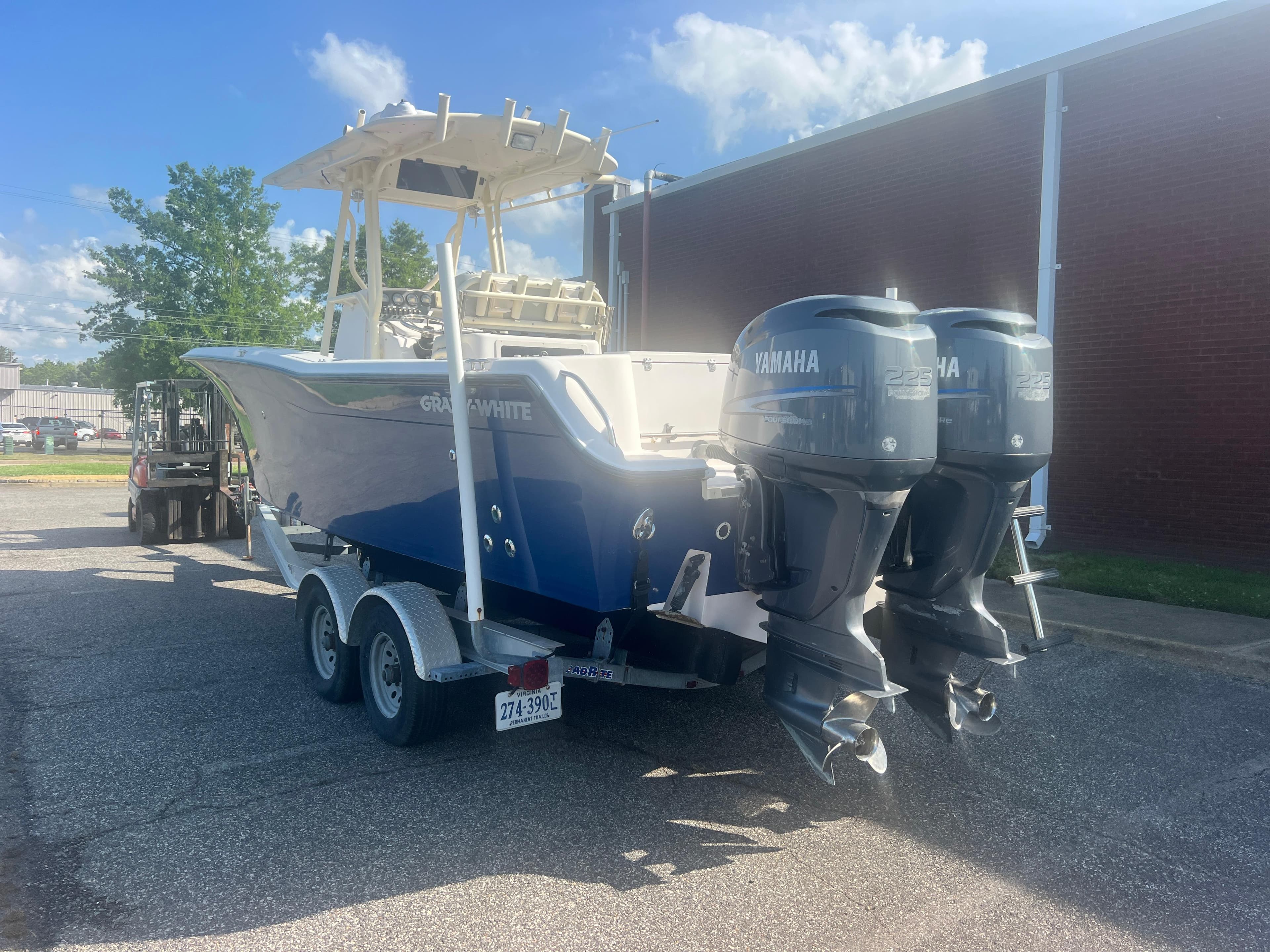 2002 Grady-White Chase 273 boat with dual Yamaha engines on a trailer.