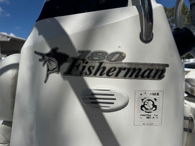 Close-up of Wellcraft 180 Fisherman boat emblem, year 2003.