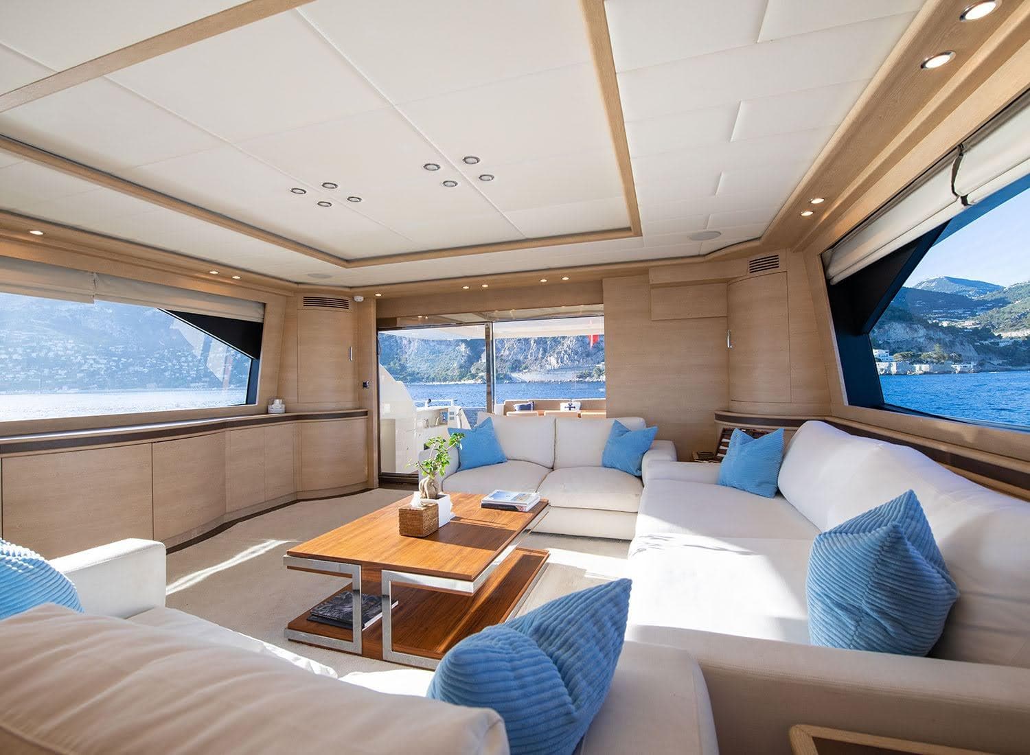 Luxurious interior of 2009 Astondoa 96 GLX yacht with elegant seating and scenic ocean views.