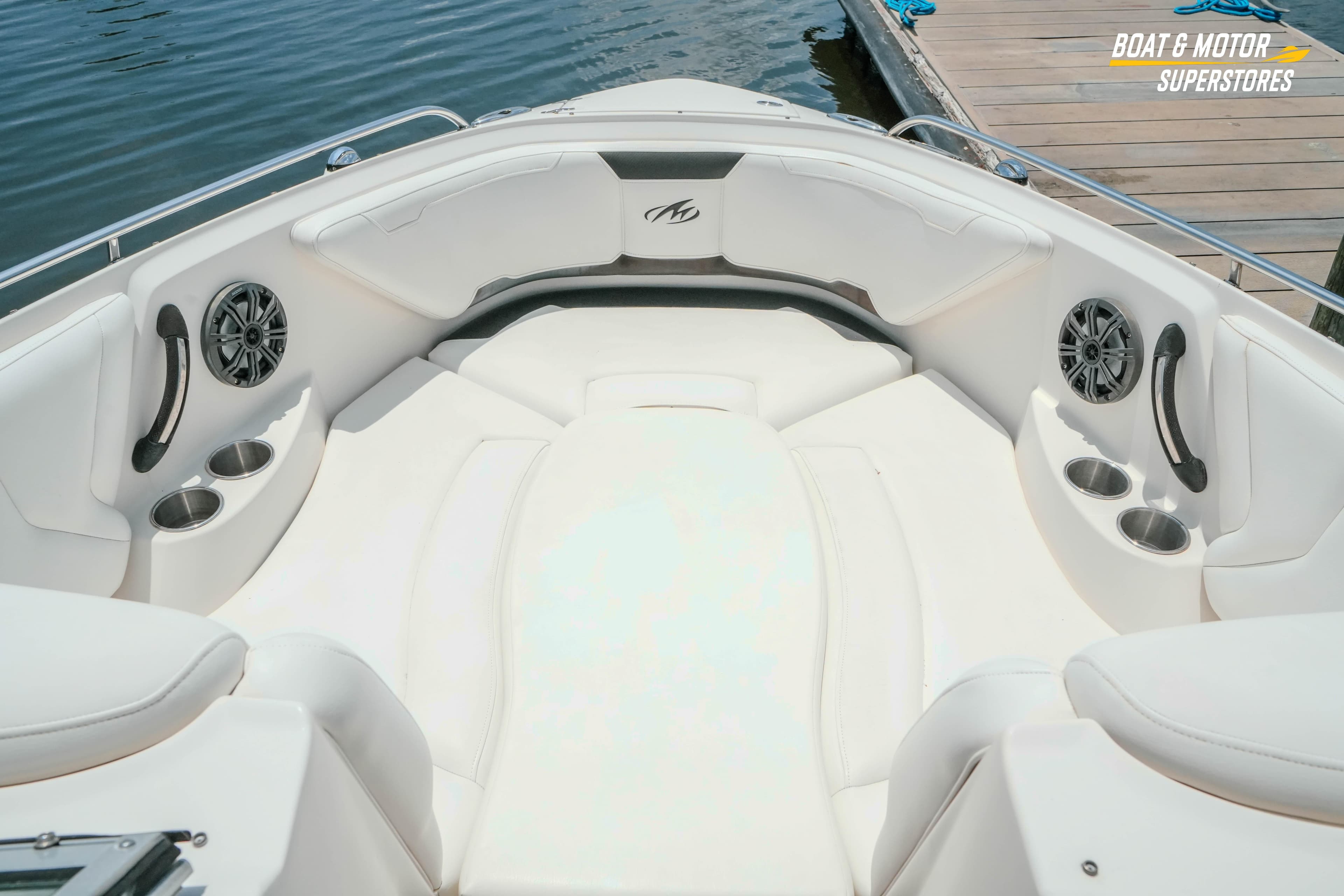 2012 Monterey 264FS boat interior with white seating and cup holders.