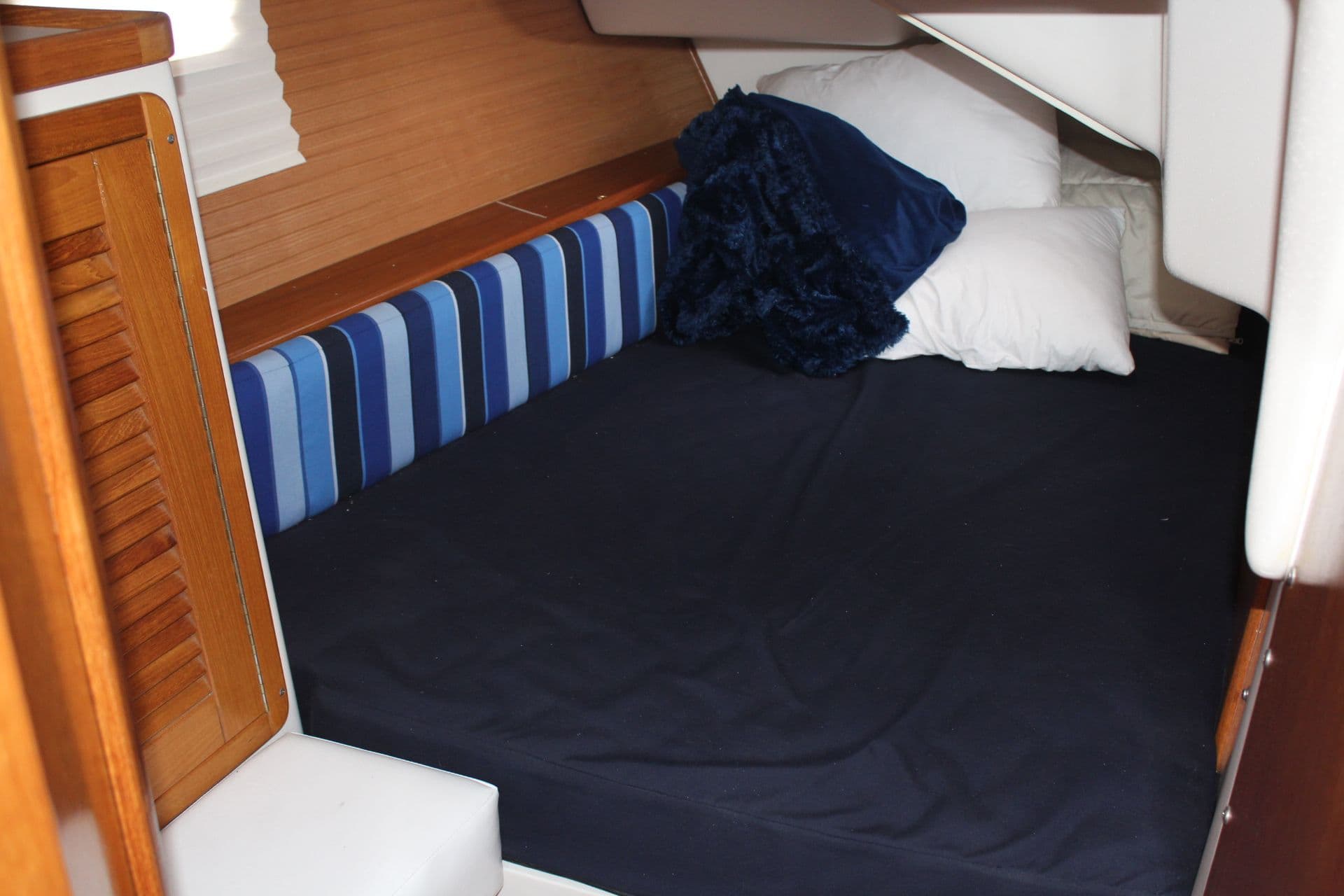 Interior of a 2004 Catalina 42 MkII yacht with cozy sleeping area.