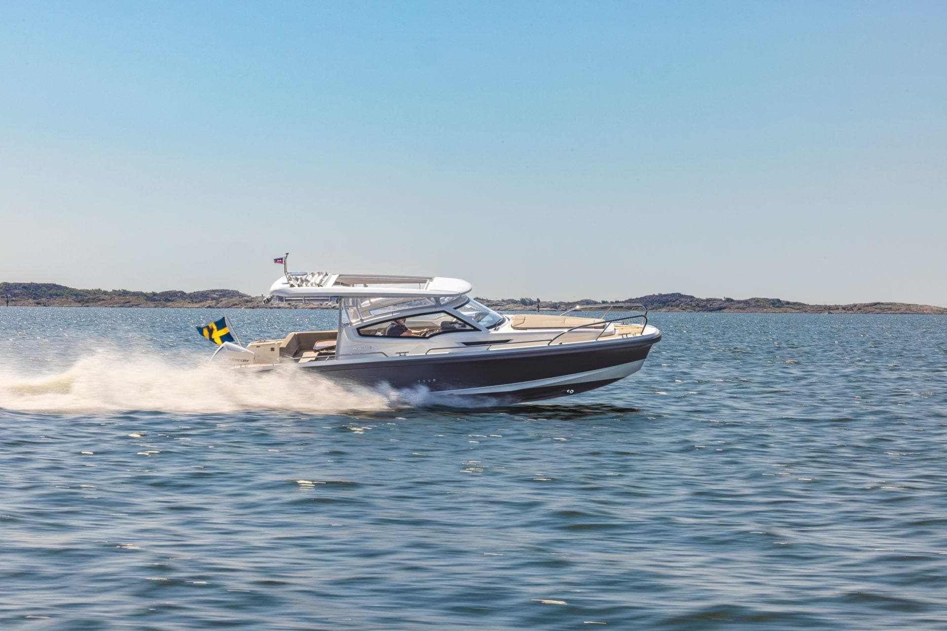 2024 Nimbus Weekender 9 boat cruising on open water.