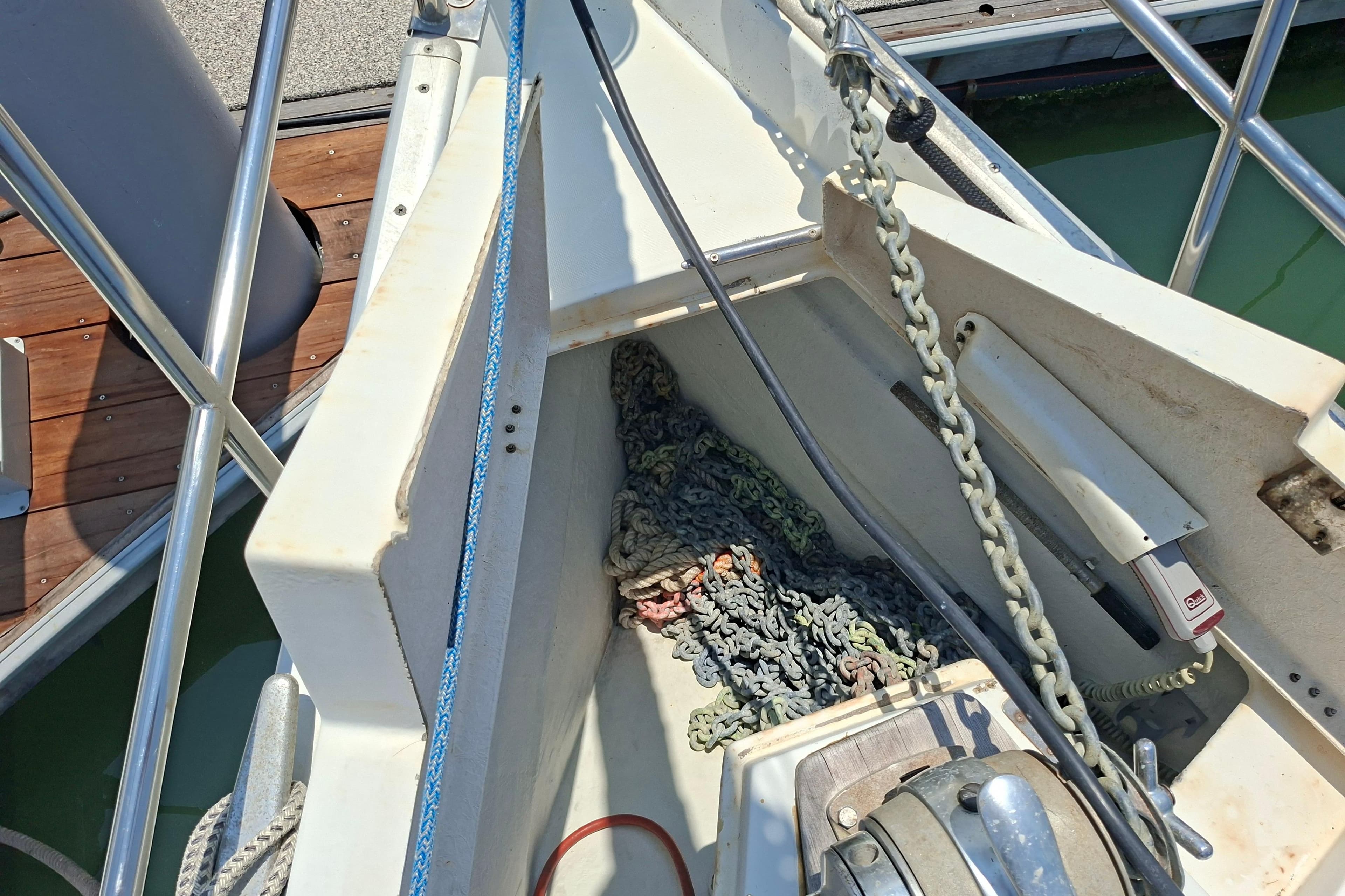 Anchor chain and ropes on a 1999 Beneteau Oceanis 40 CC sailboat deck.