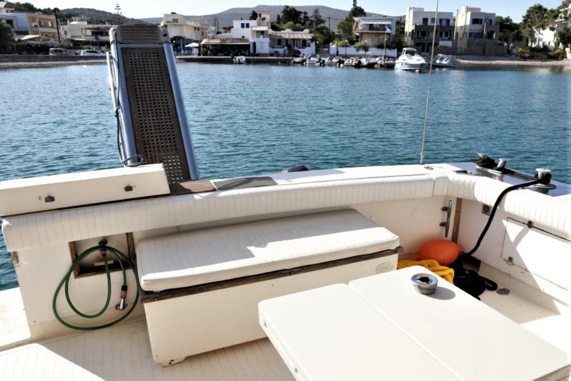 1986 Bertram 54 Convertible yacht deck with scenic waterfront view.