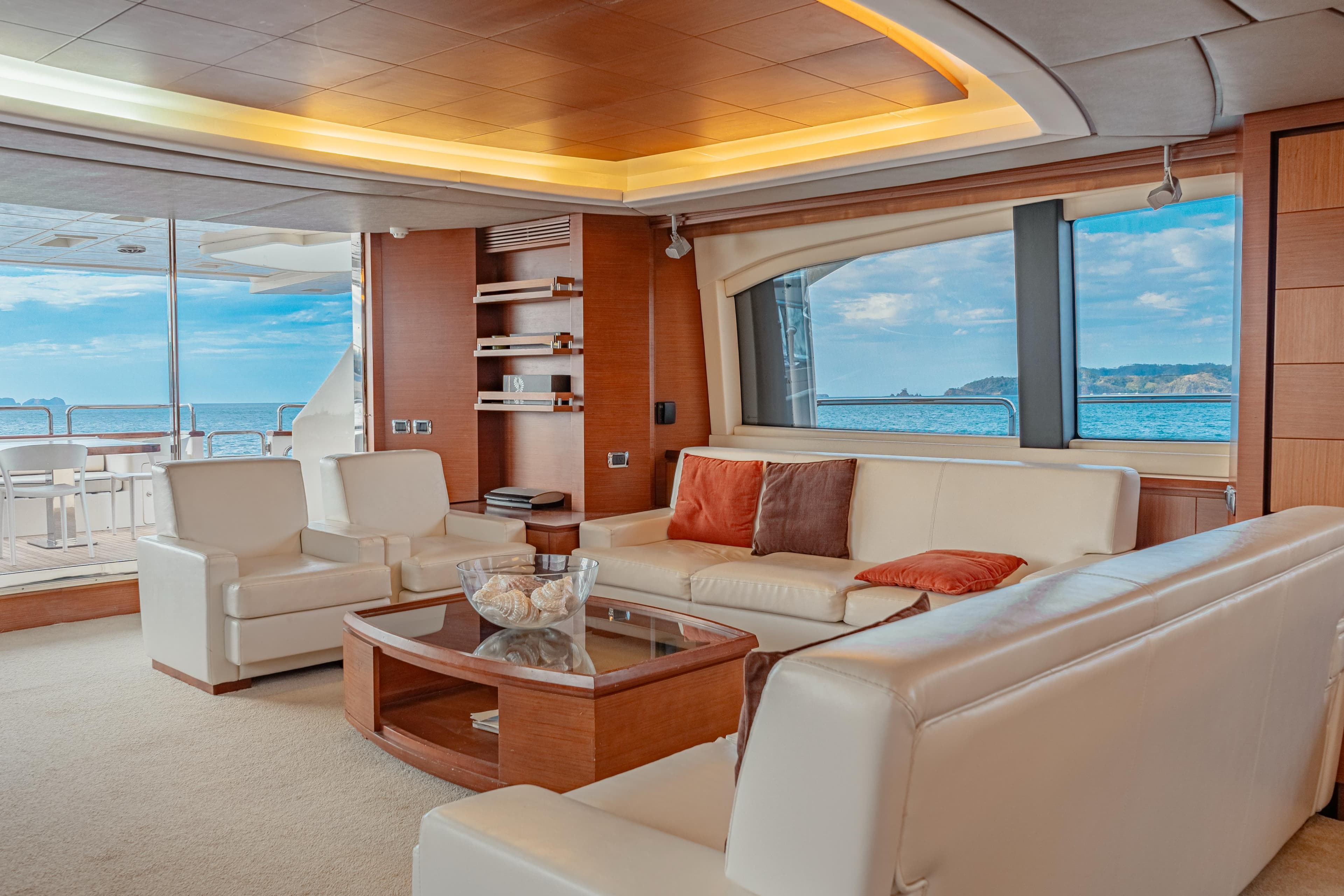 Luxurious interior of 2006 Azimut 105 yacht with elegant seating and ocean view.