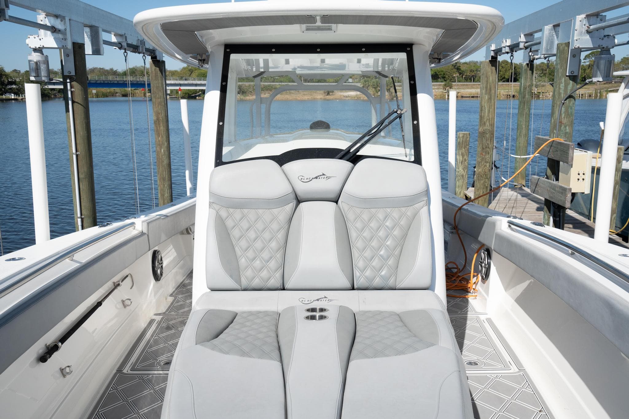 2020 Blackwater 43 Sportfish boat interior with luxurious seating and waterfront view.