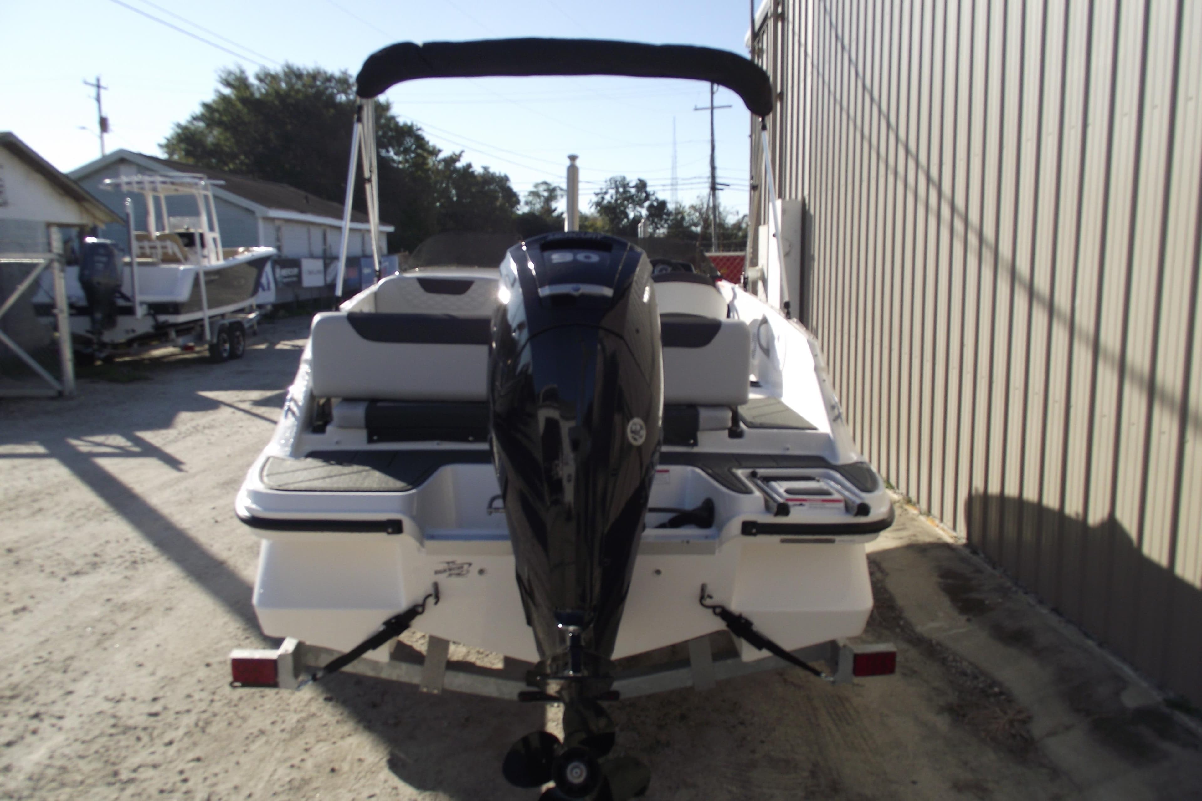 2026 Bayliner M19 boat with outboard motor.