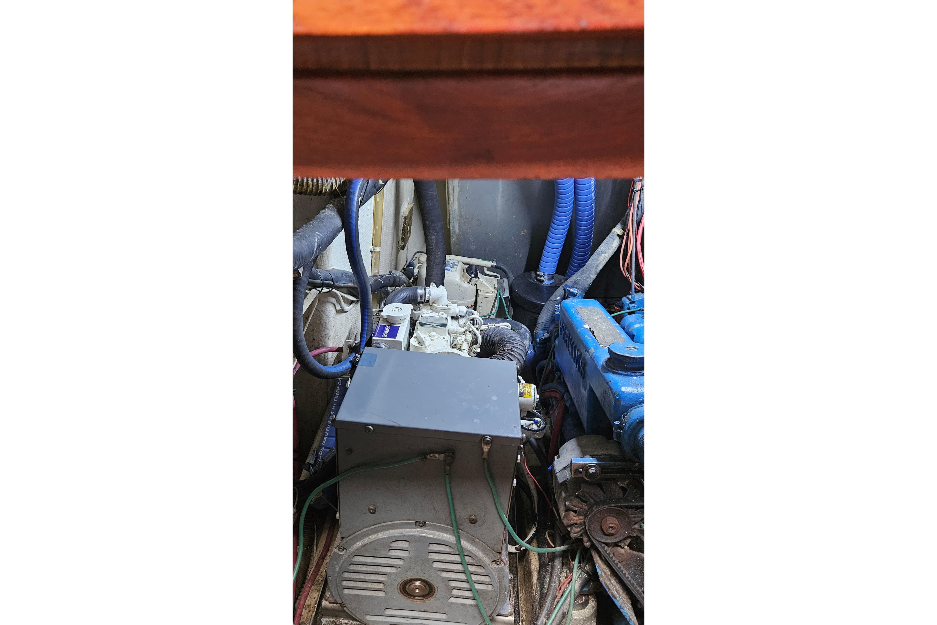 Engine compartment of a 1979 CSY 44 CC sailboat, featuring various mechanical components.