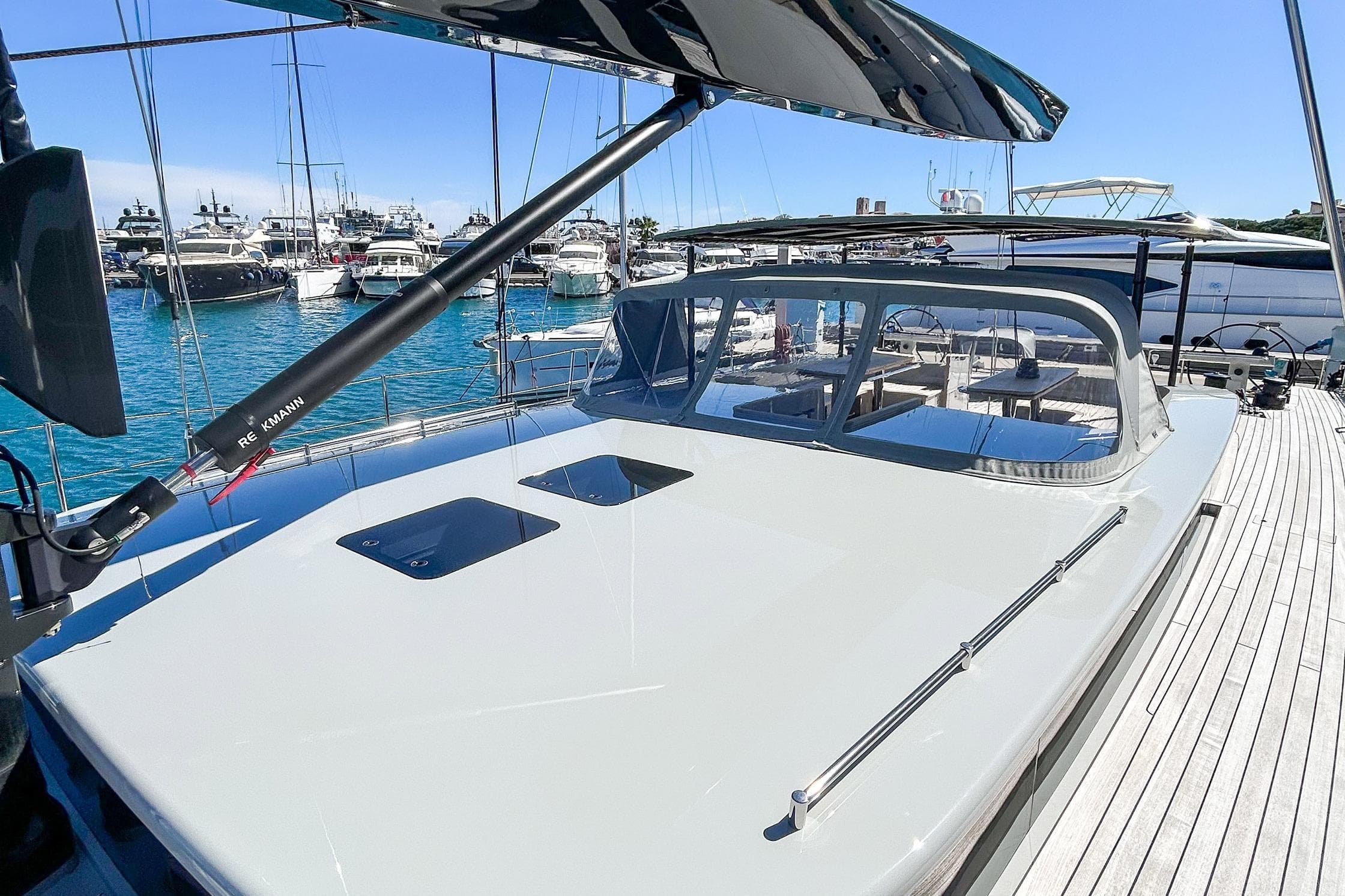2024 YYachts Y8 luxury yacht docked at marina, showcasing sleek design and spacious deck.