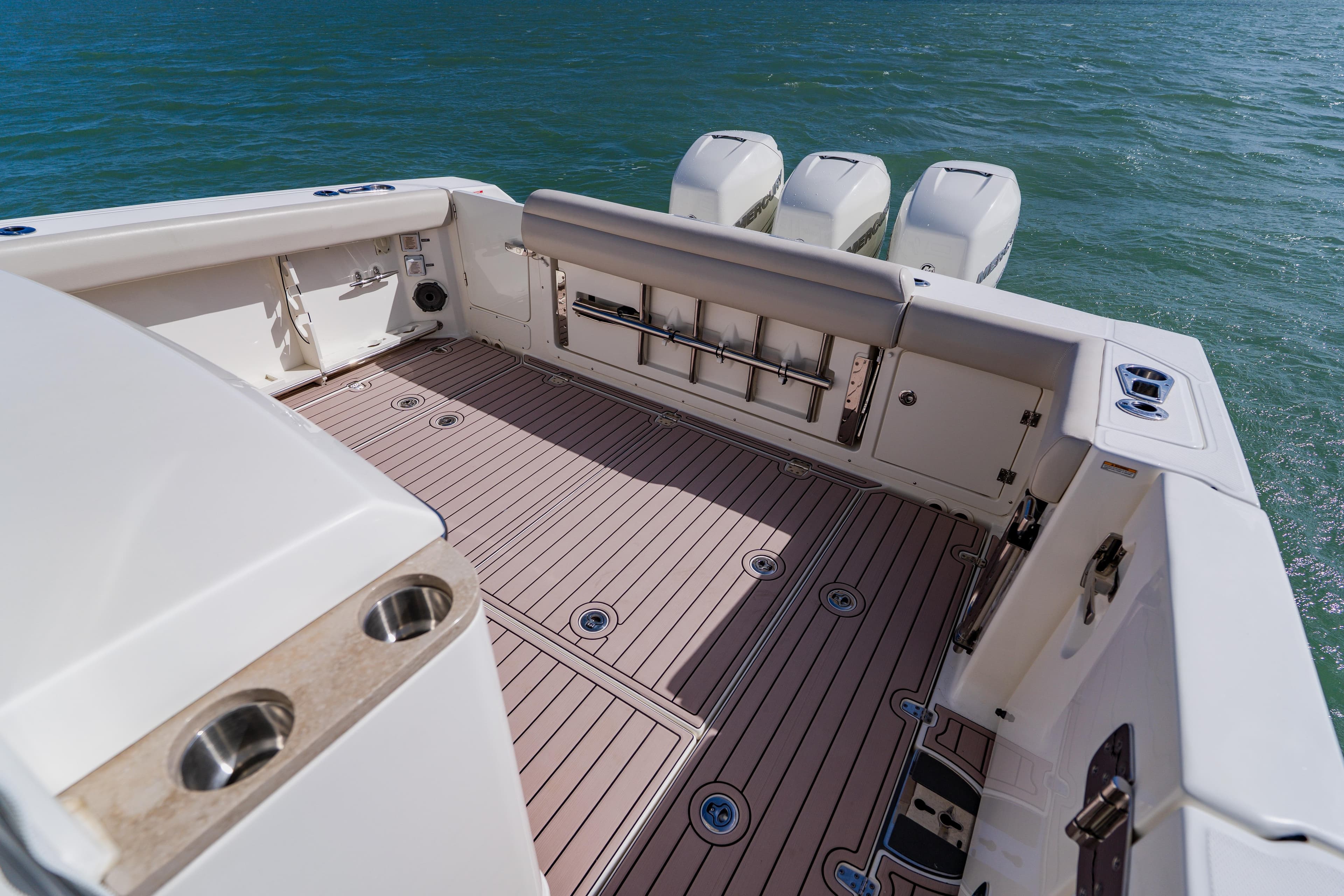 2019 Boston Whaler 380 Outrage boat deck with triple outboard engines.