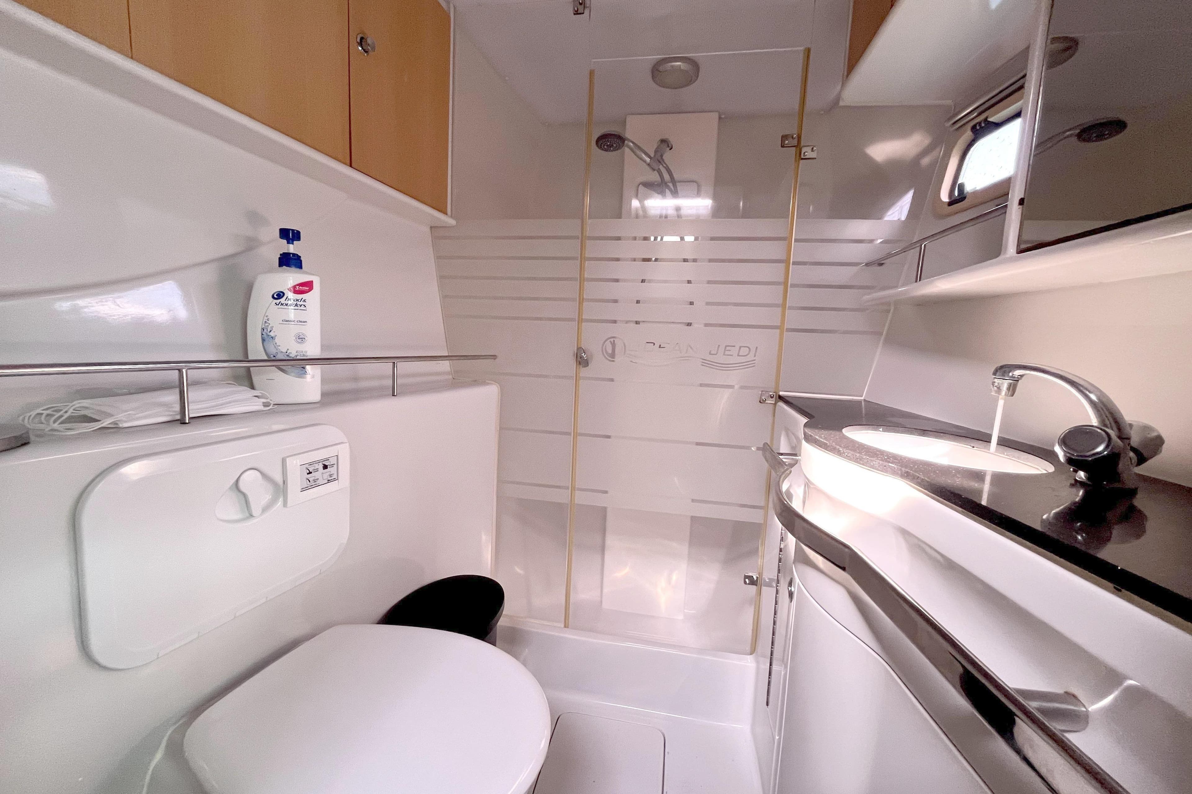 Luxurious bathroom in 2009 Kelsall 58 KSS yacht with modern fixtures and shower.