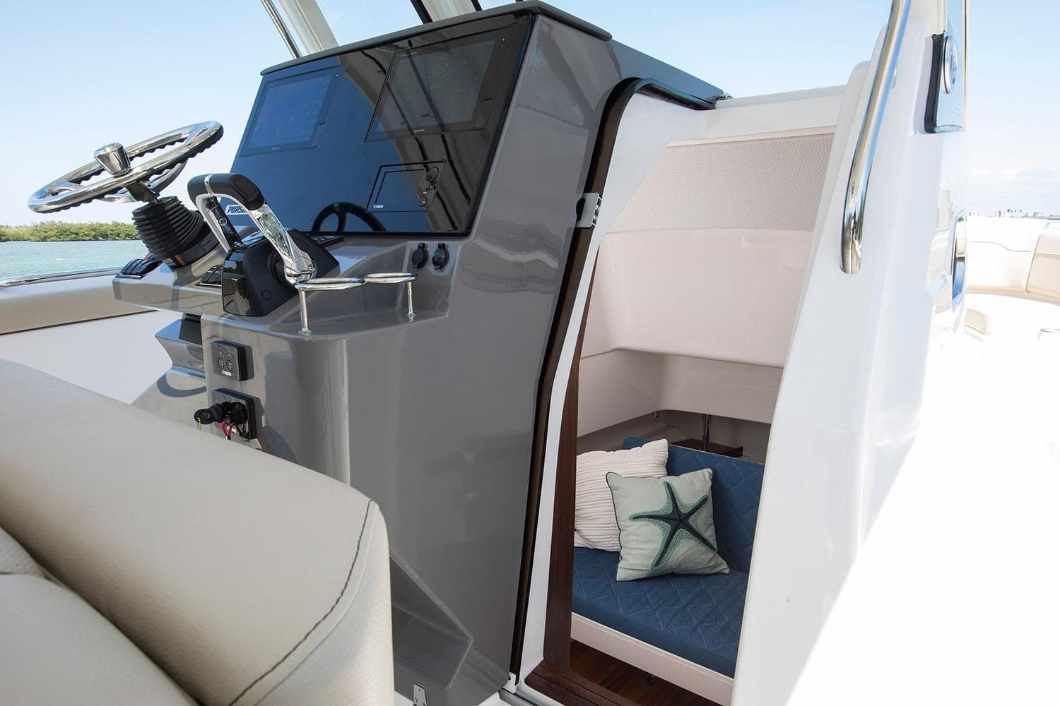 Manufacturer Provided Image: 2021 Pursuit S 328 Sport boat interior with helm and cabin.