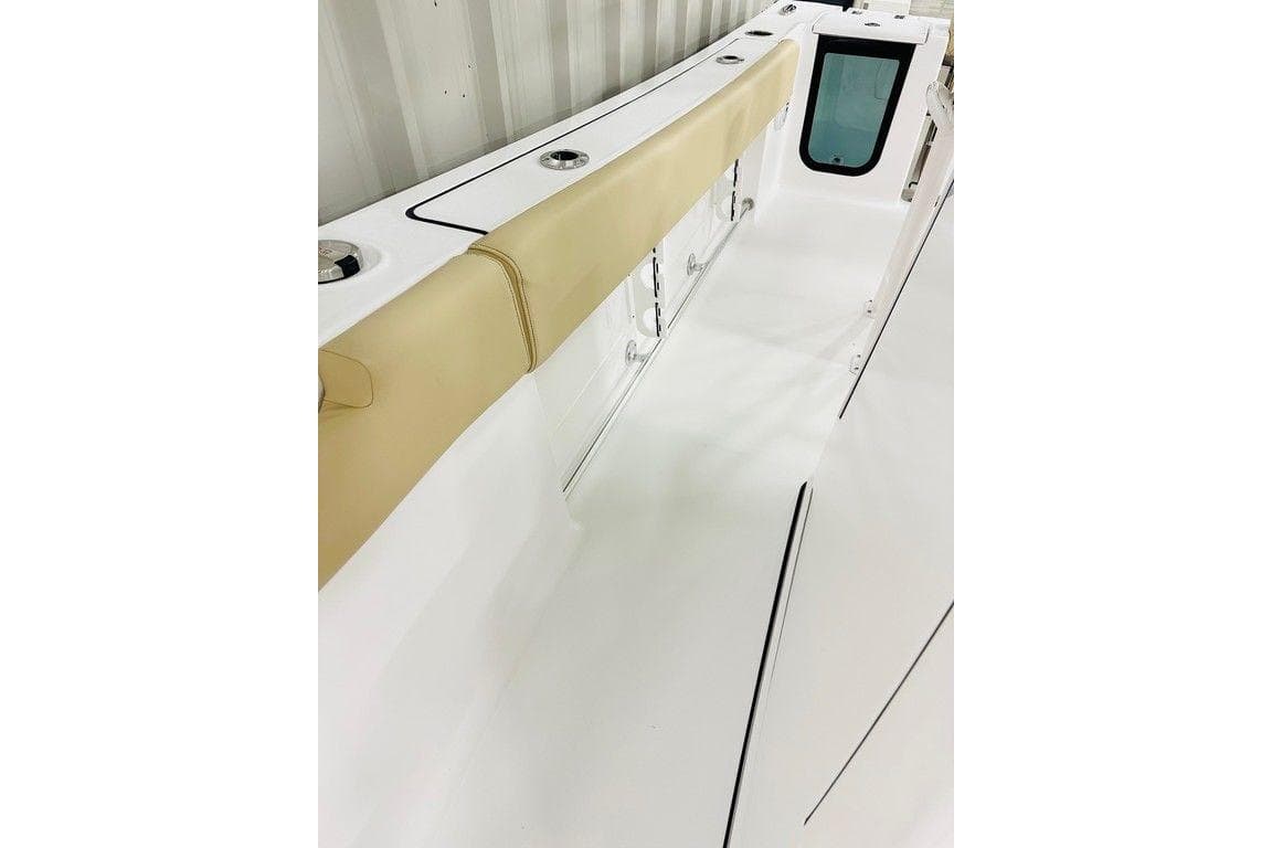 2026 Sportsman Open 232 Center Console boat interior with beige seating and sleek design.