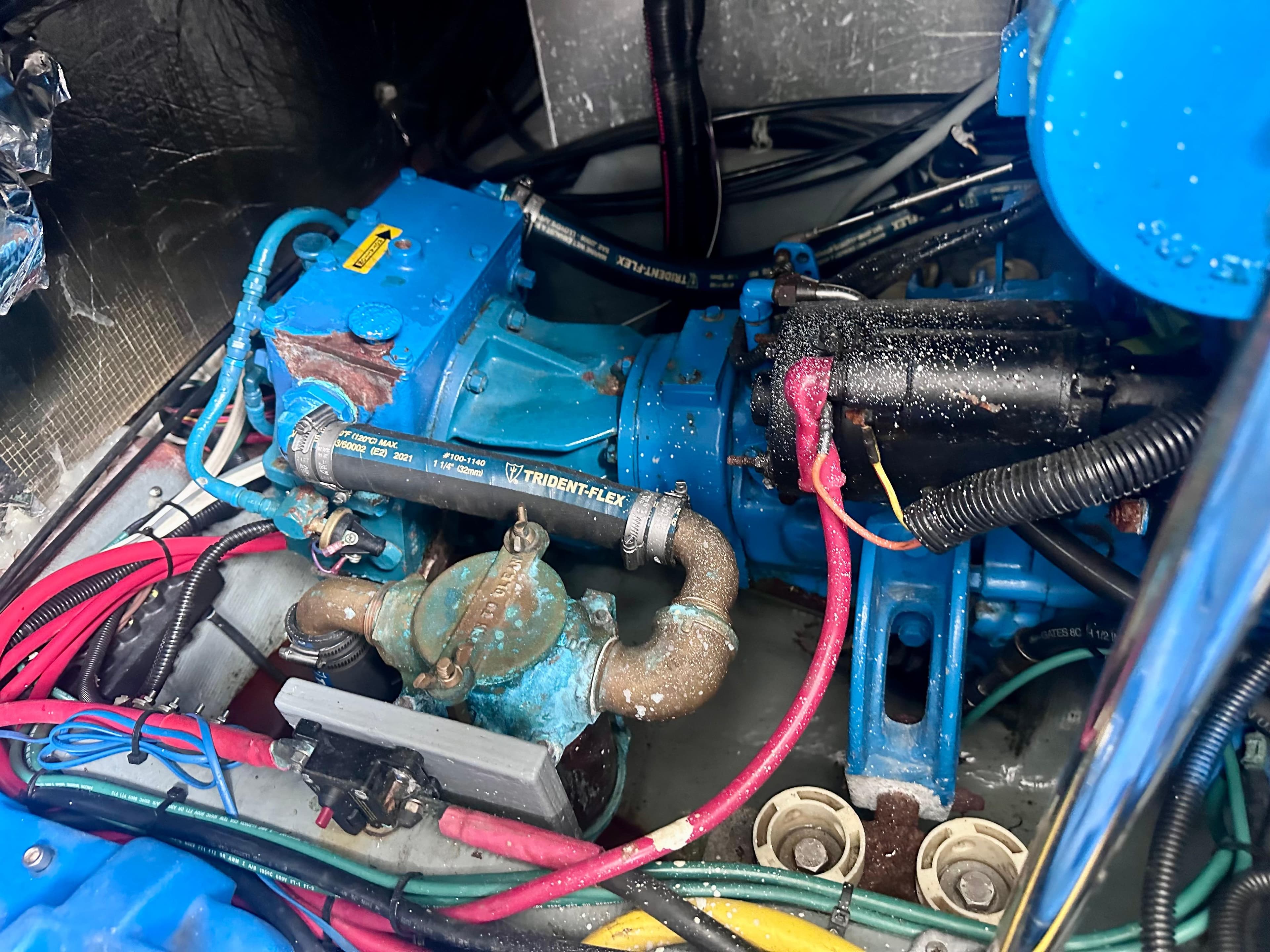 Engine compartment of a 1997 Carver 350 Mariner with visible wiring and components.