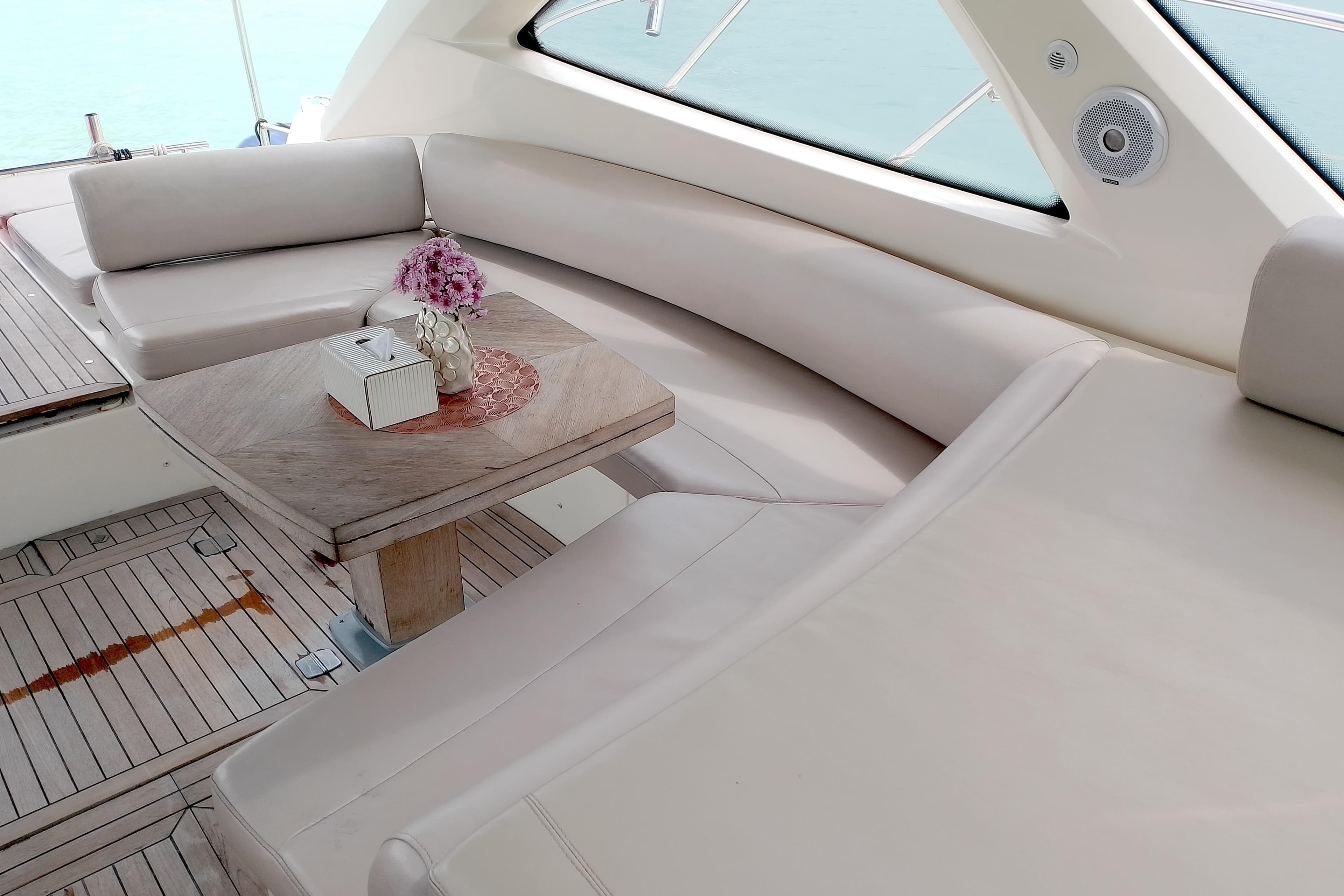 Luxurious seating area on a 2007 Azimut Atlantis 50 yacht with elegant decor.