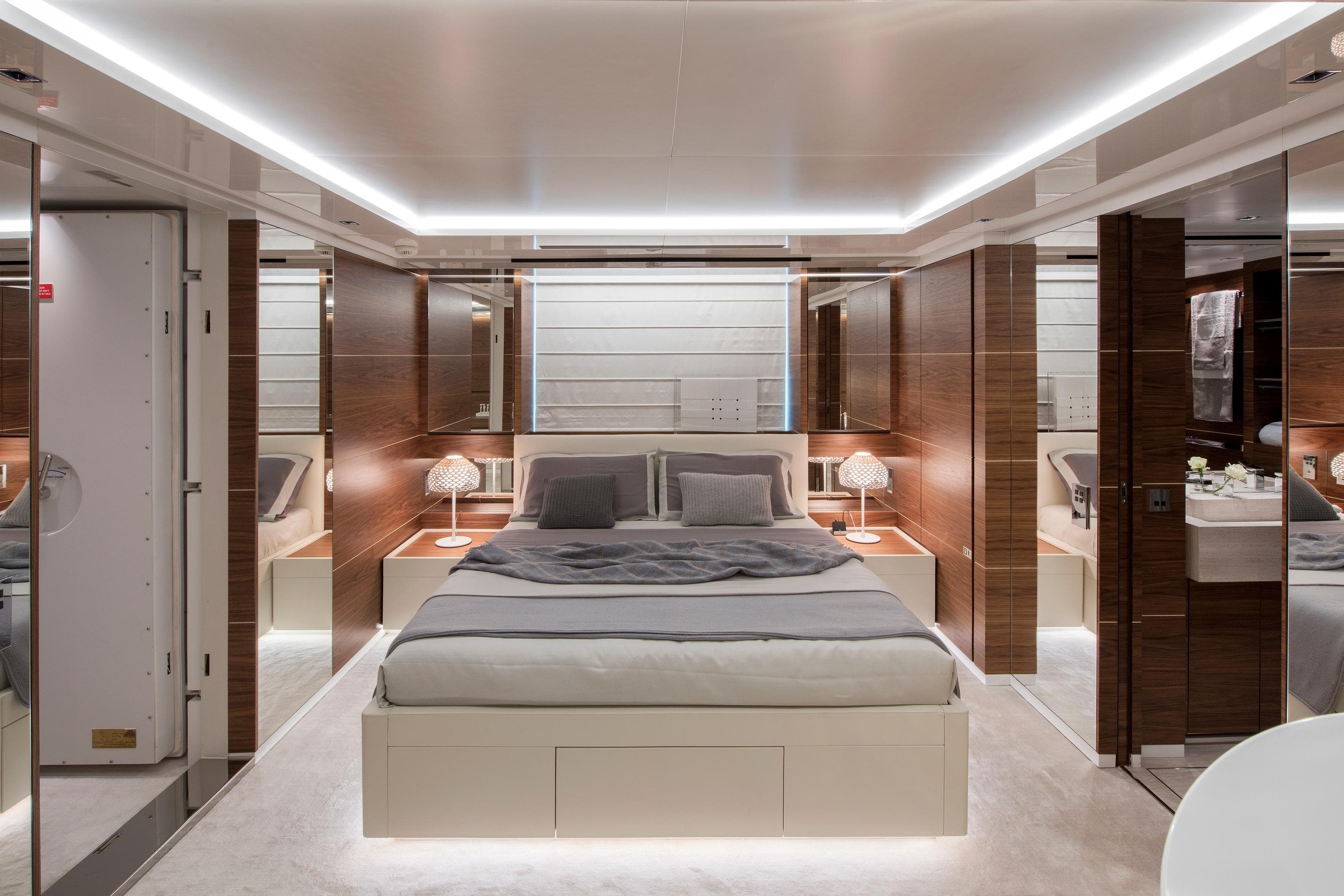 Luxurious bedroom interior on 2019 Sanlorenzo 40Alloy yacht, featuring modern design and ambient lighting.