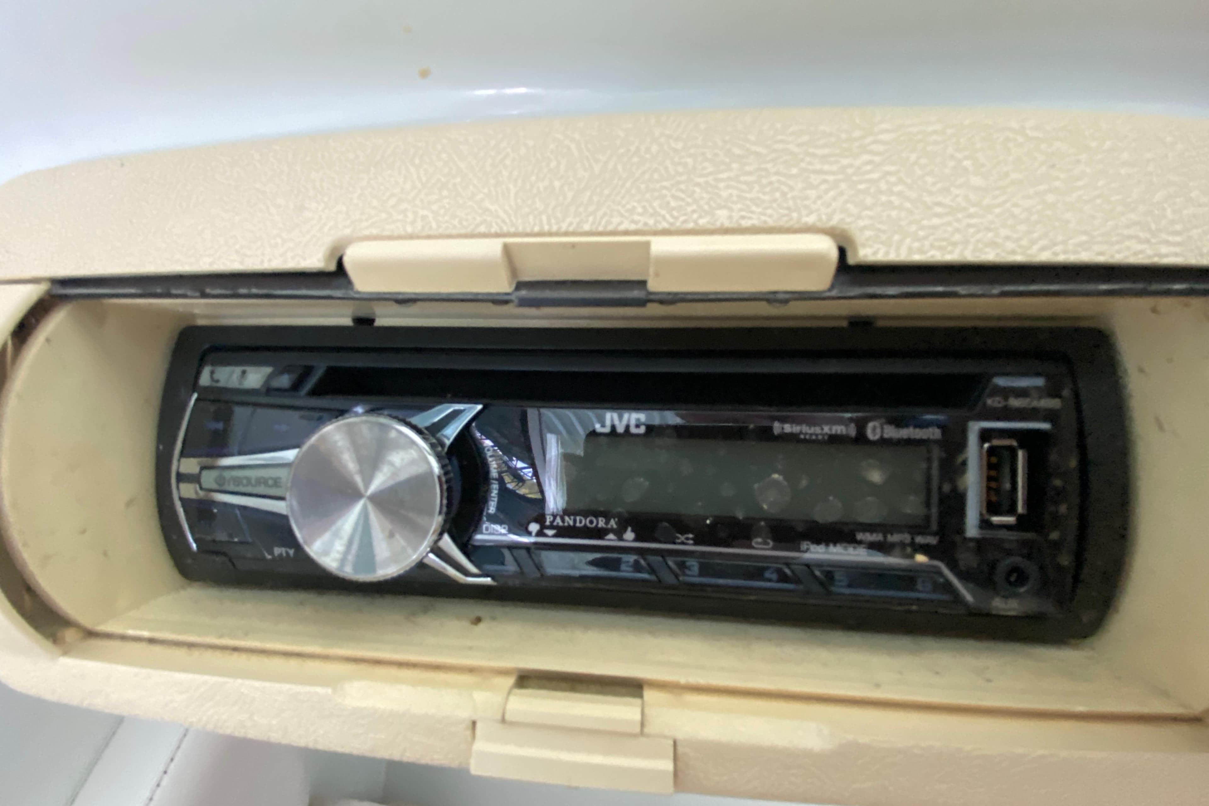 1997 Baja 302 Boss boat with JVC stereo system, featuring Bluetooth and USB connectivity.