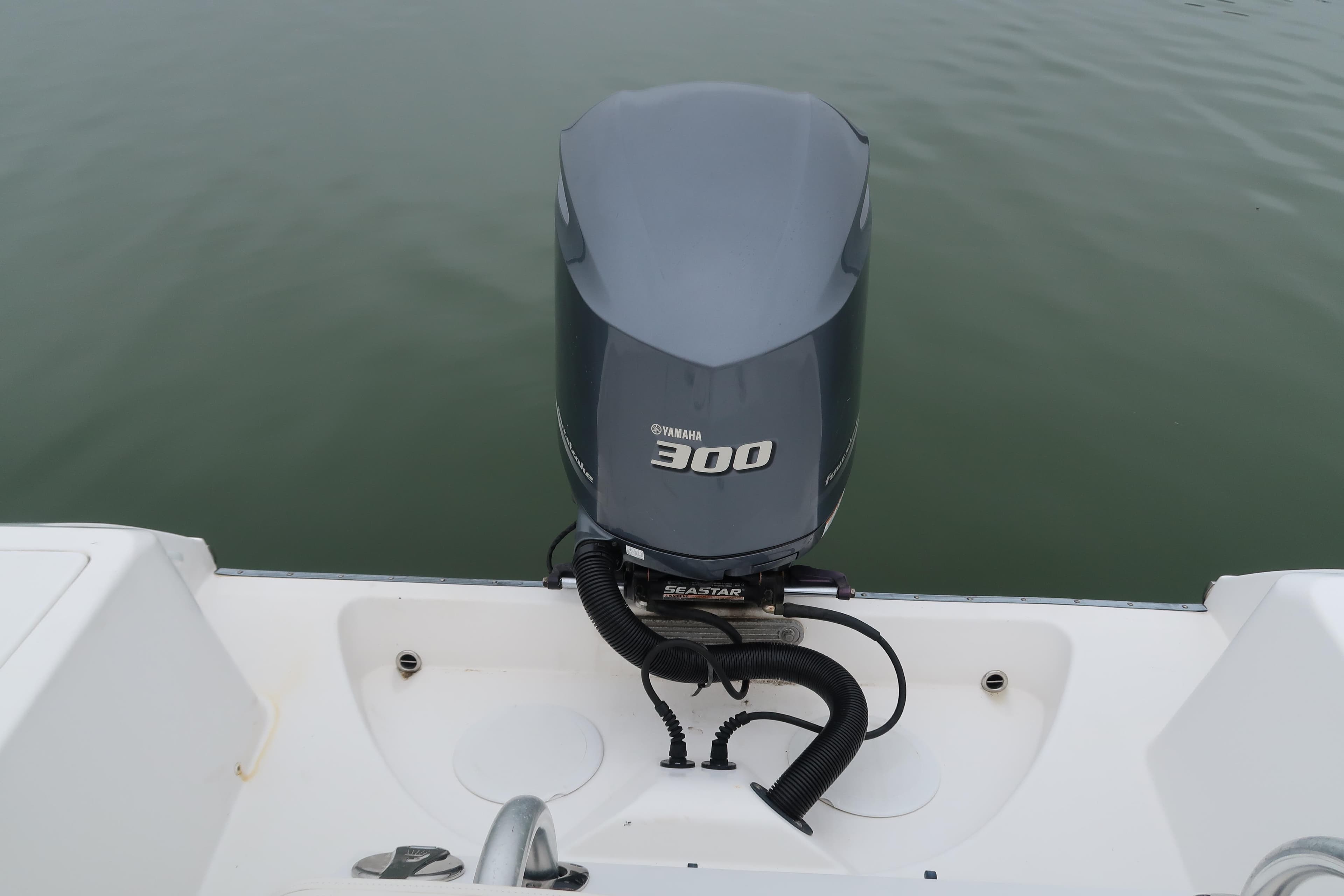 2017 Edgewater 245CC boat with Yamaha 300 outboard motor on calm water.