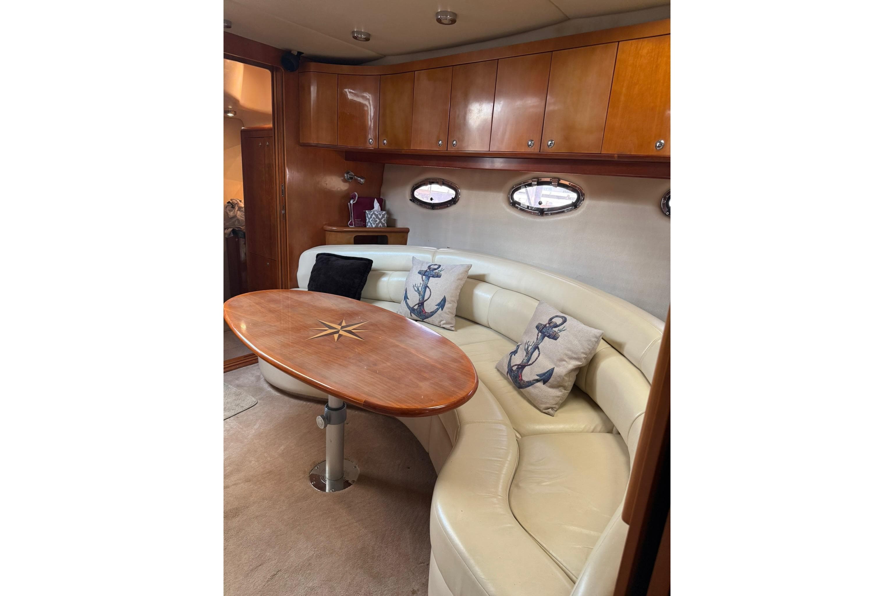 Luxurious interior of 2003 Regal Commodore 4260 yacht with elegant seating and nautical decor.