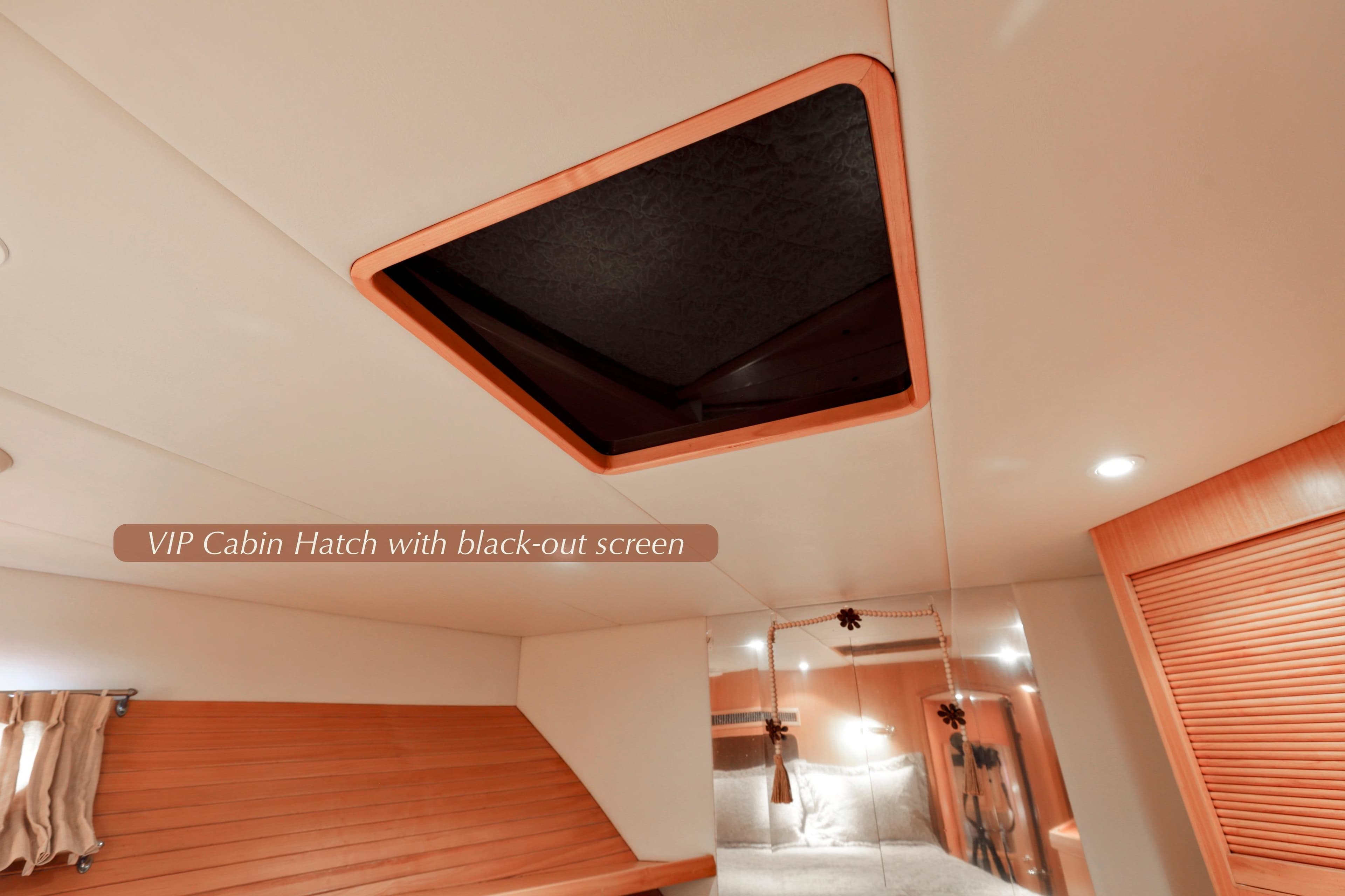 2004 McKinna 57 Pilothouse VIP cabin with blackout hatch screen.