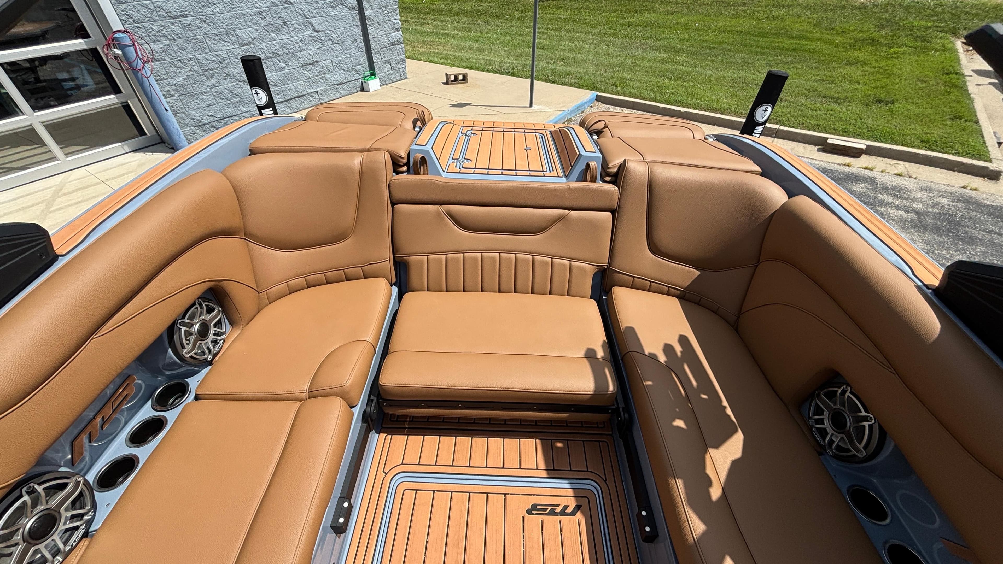 Luxurious interior of 2025 MB B52 23 Alpha boat with tan leather seating.