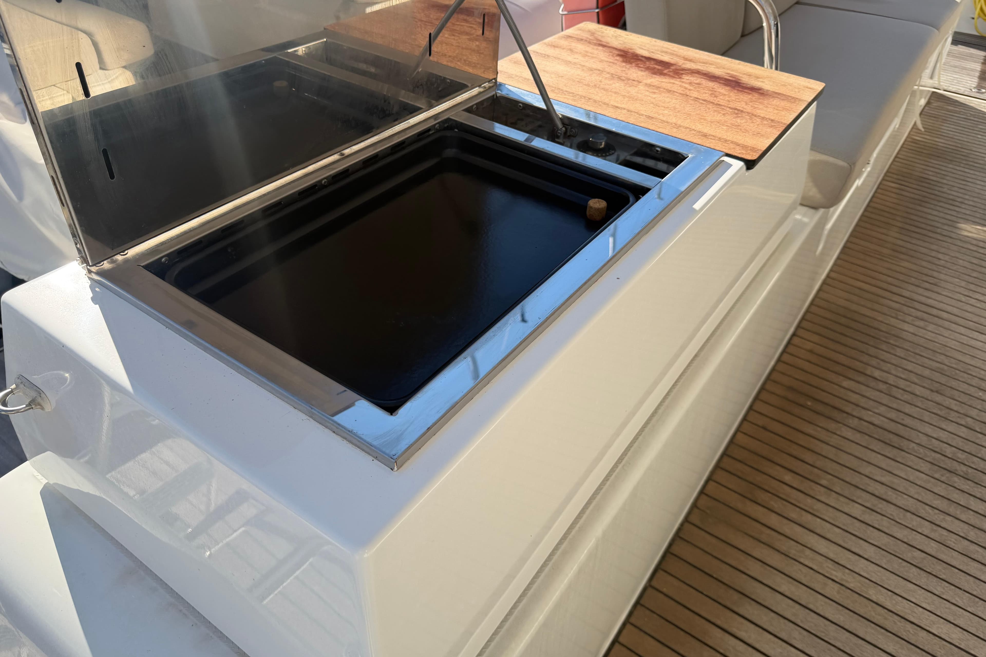 2024 Fountaine Pajot Astrea 42 Catamaran outdoor kitchen with grill and wooden countertop.