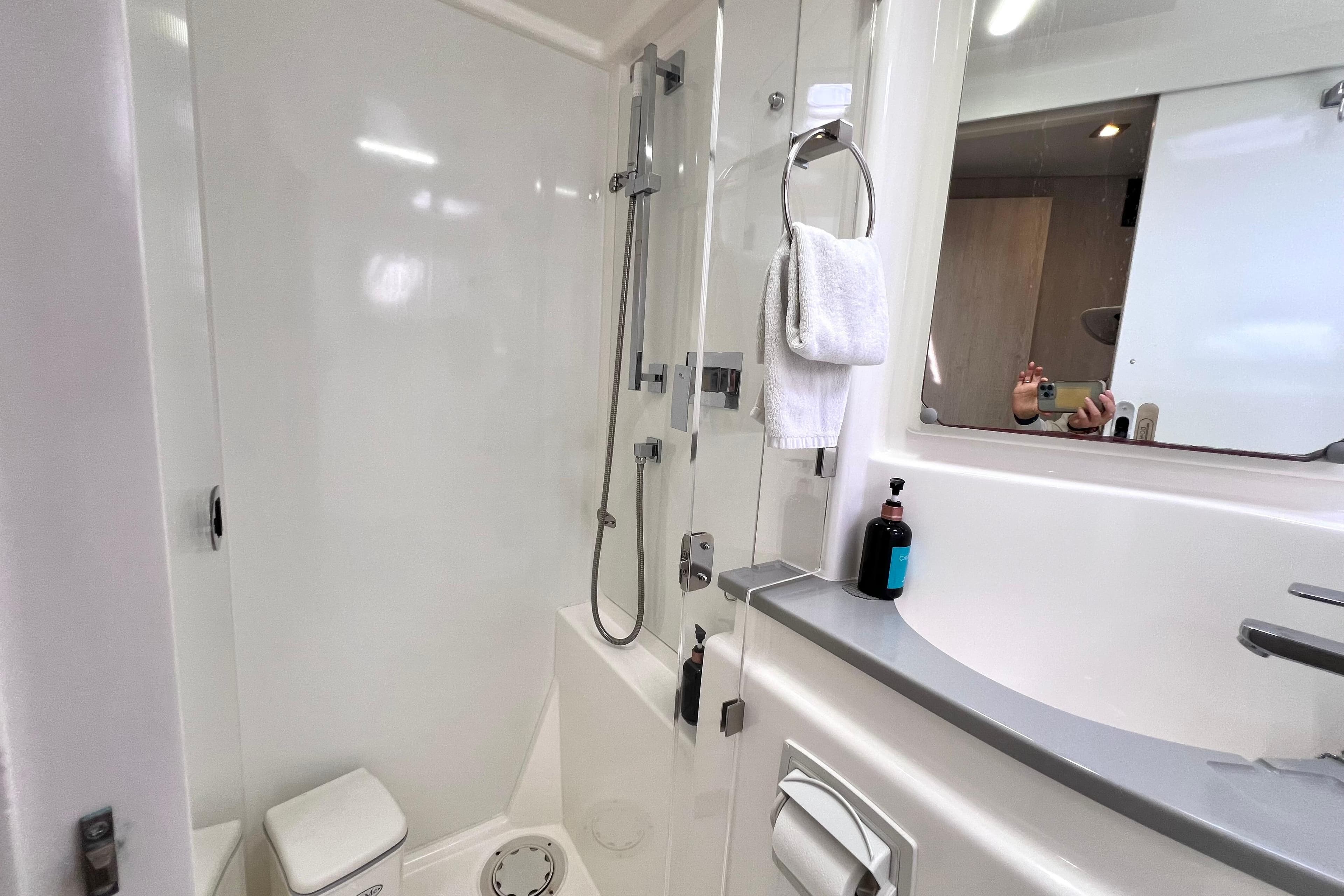 Bathroom interior of 2019 Leopard 51 Powercat yacht with modern shower and sink.
