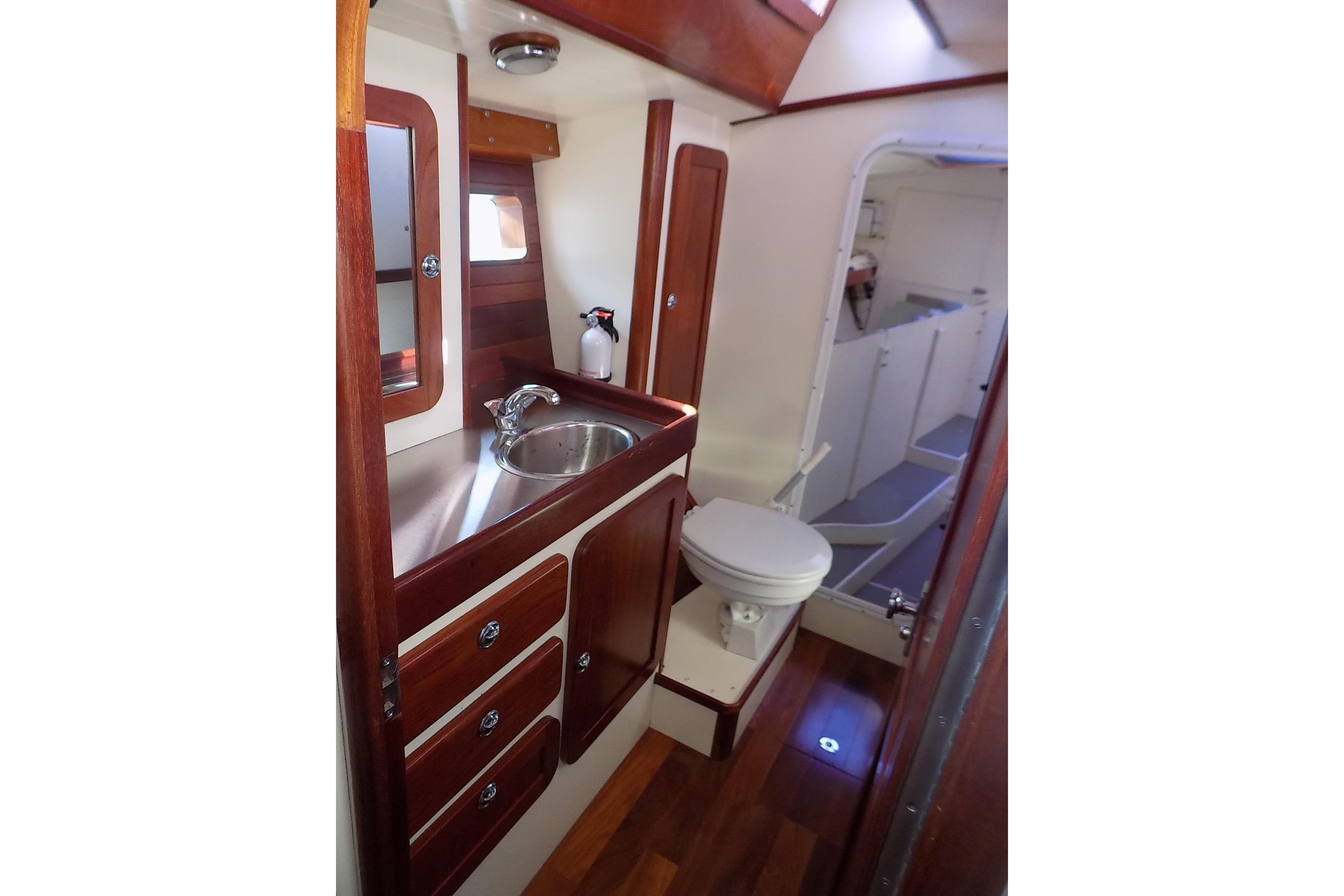 Luxurious 2014 Custom Aluminum Expedition yacht bathroom with wood accents and modern fixtures.