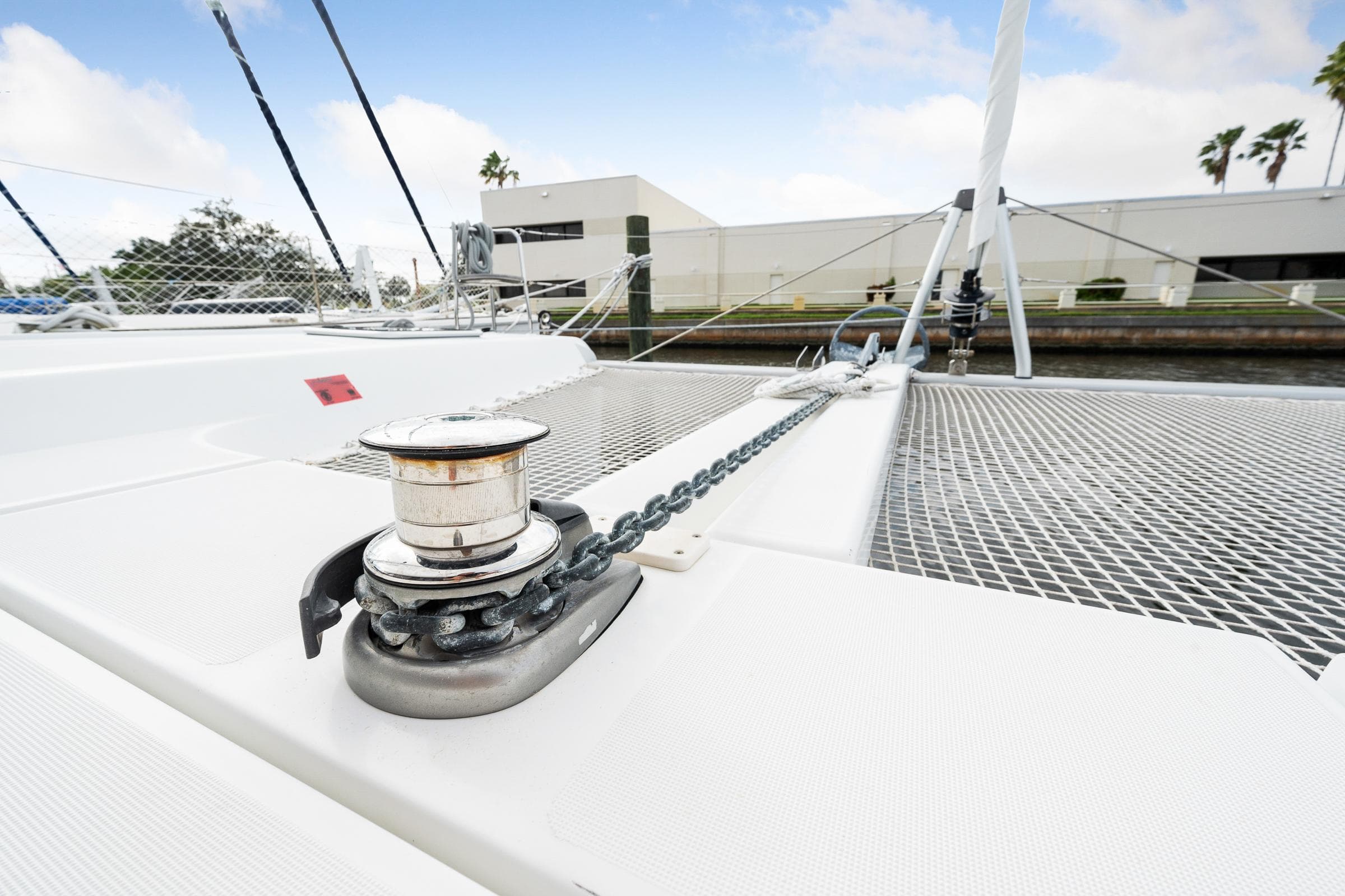 Lagoon 42 catamaran 2018 model, deck view with anchor chain and winch.