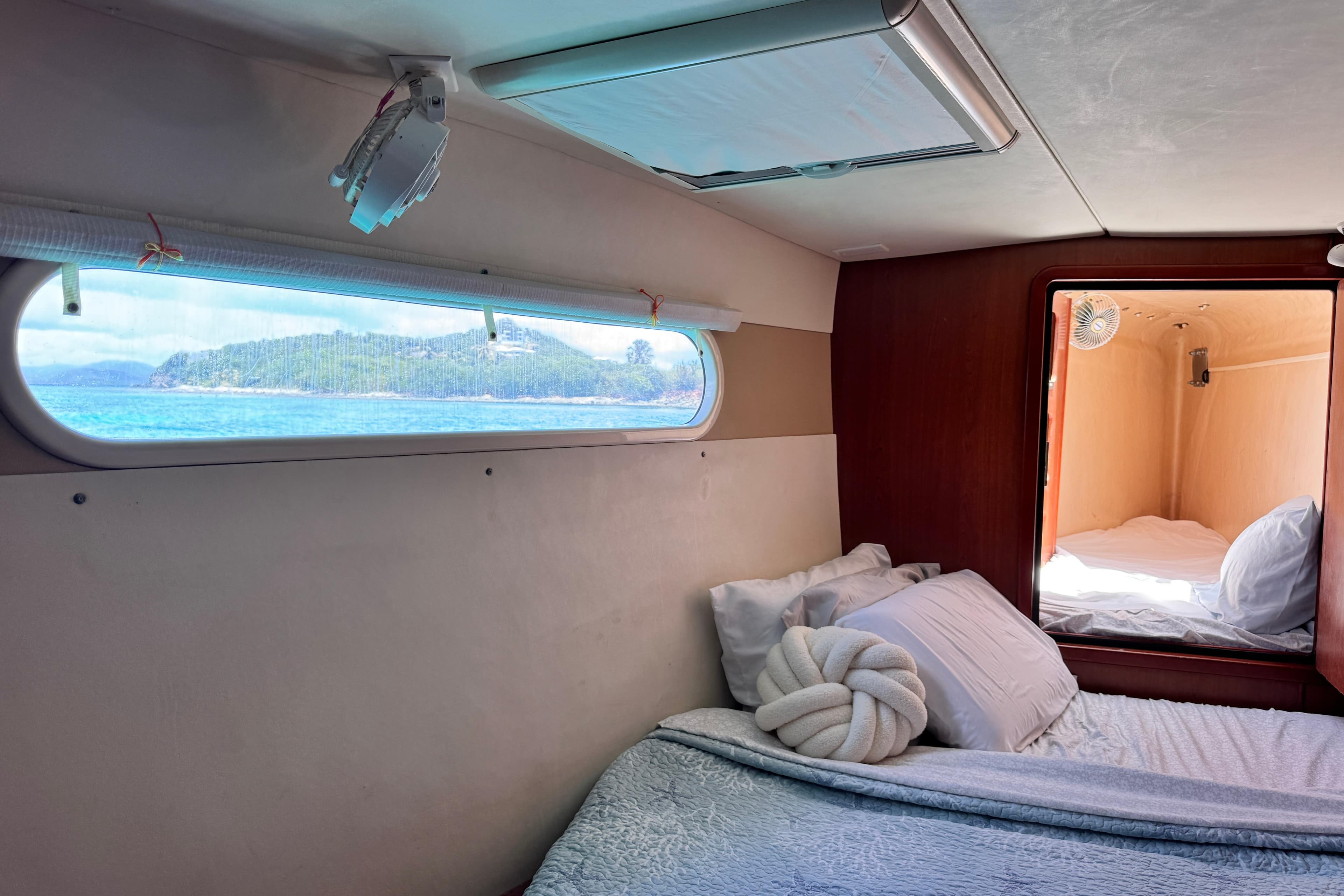 Interior of 2011 Leopard 46 yacht cabin with ocean view through window.