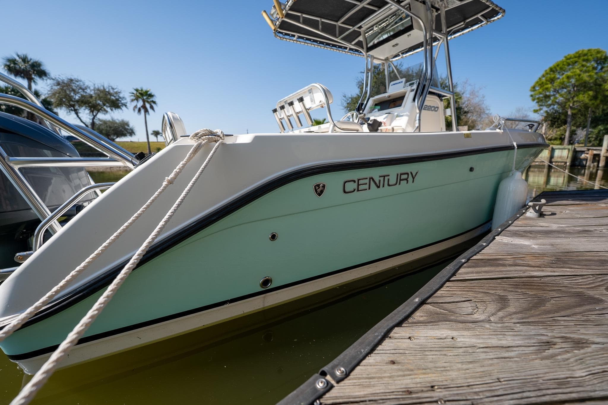 Century 2200 Center Console boat, 2007 model, docked on a sunny day.