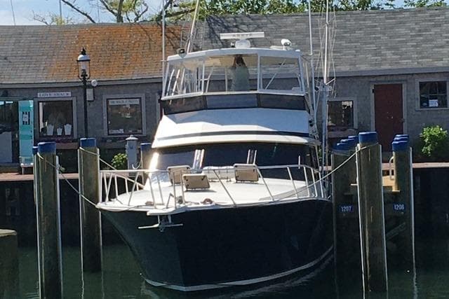 1988 Viking 45 Convertible yacht docked at a marina, front view.