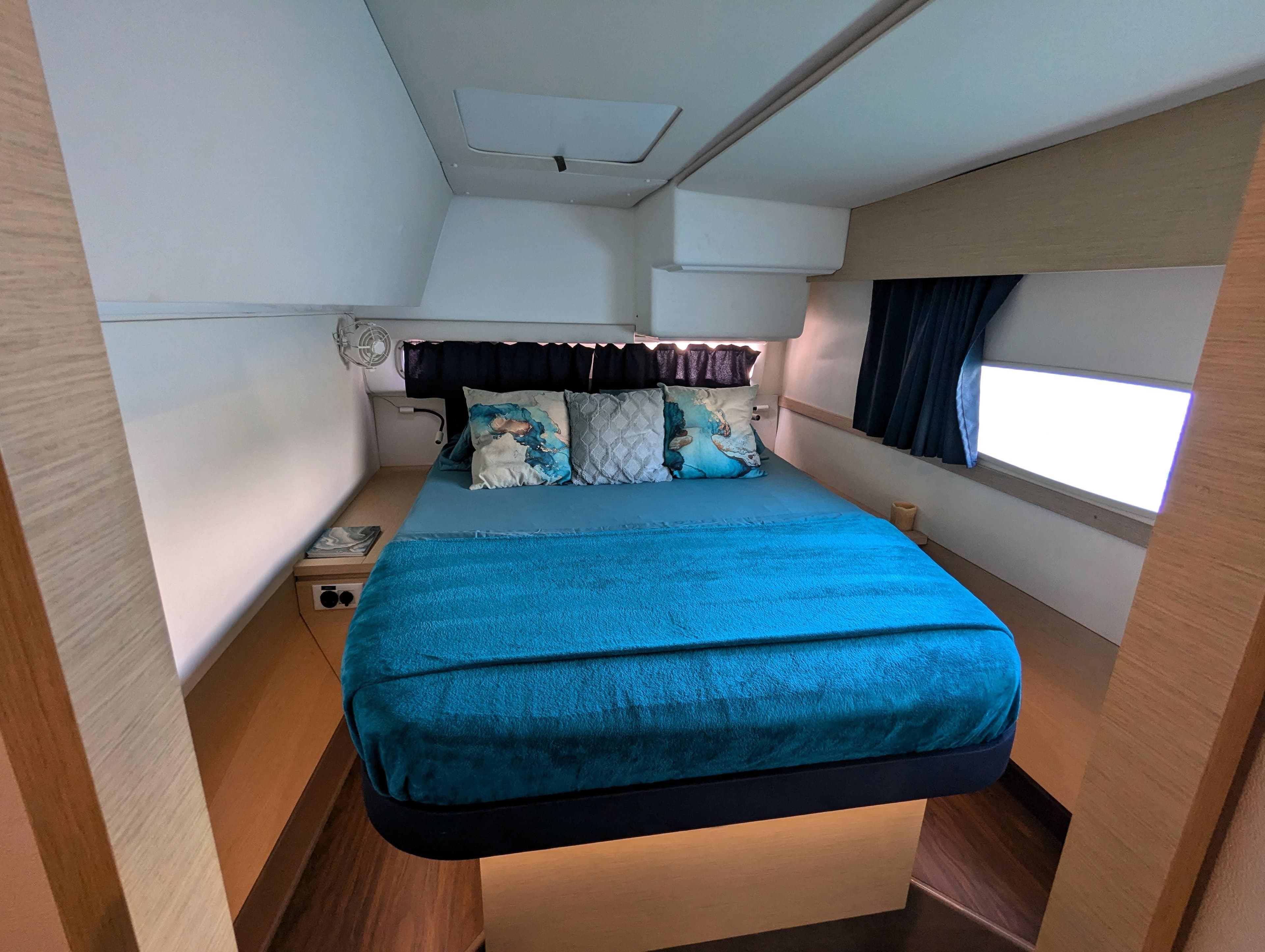 2017 Fountaine Pajot Helia 44 Evolution cabin with blue bedding and modern decor.