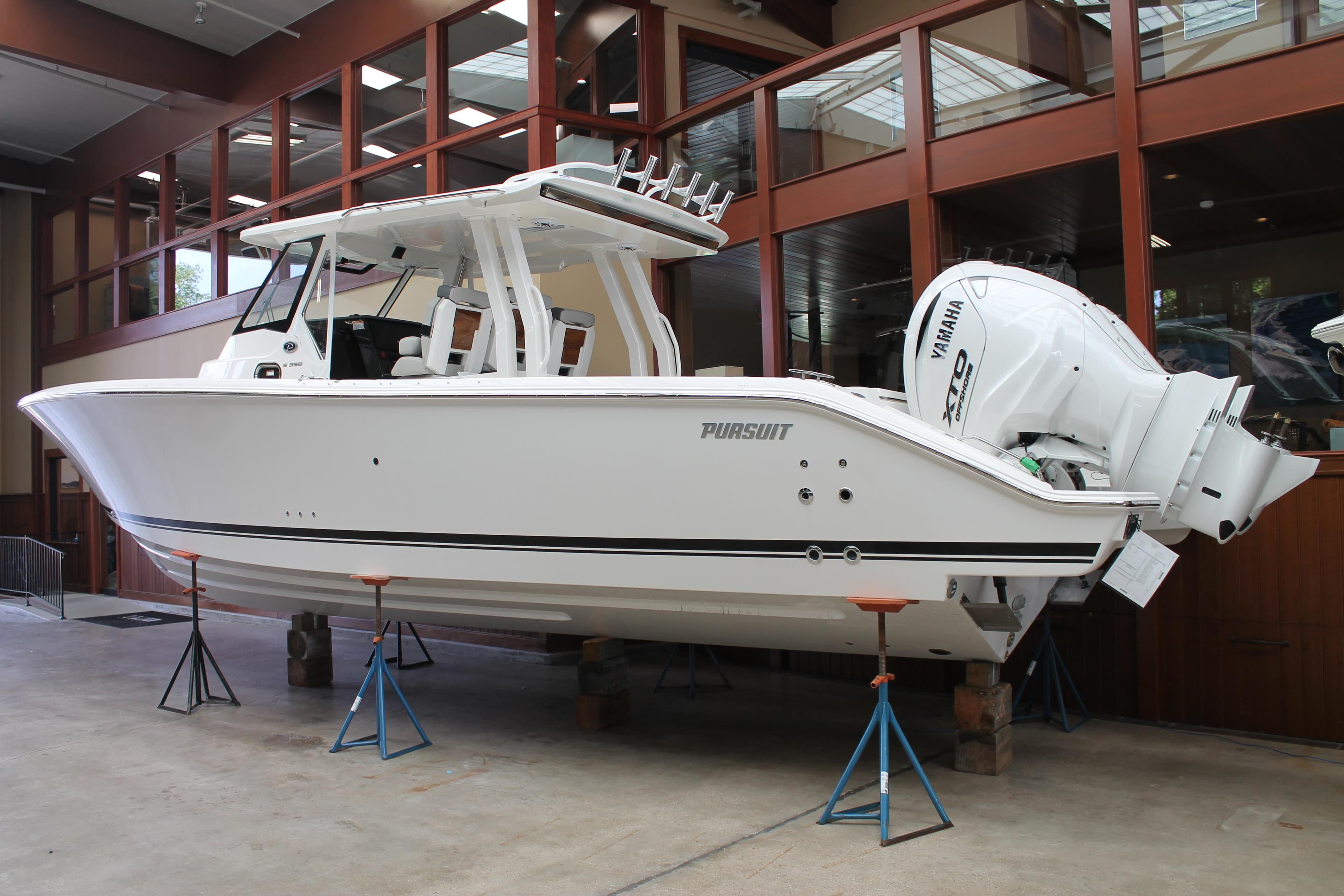 2025 Pursuit S 358 Sport boat on display indoors.