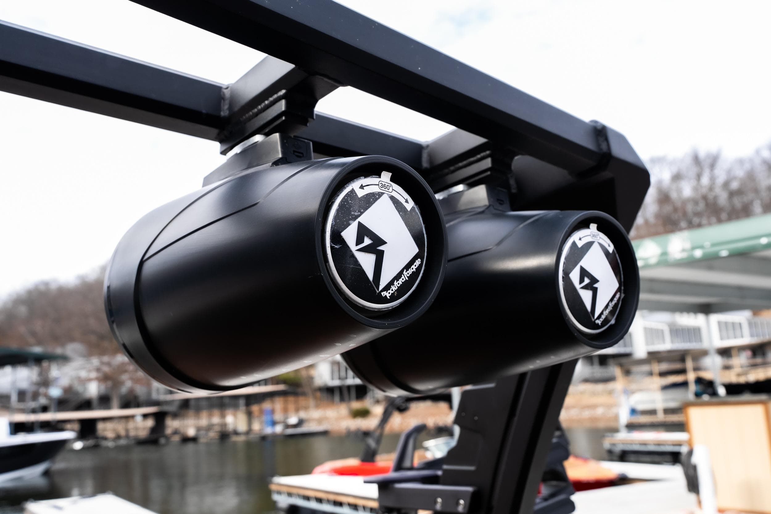 Close-up of Anthem Assault ST23 speakers on a boat, dockside view.