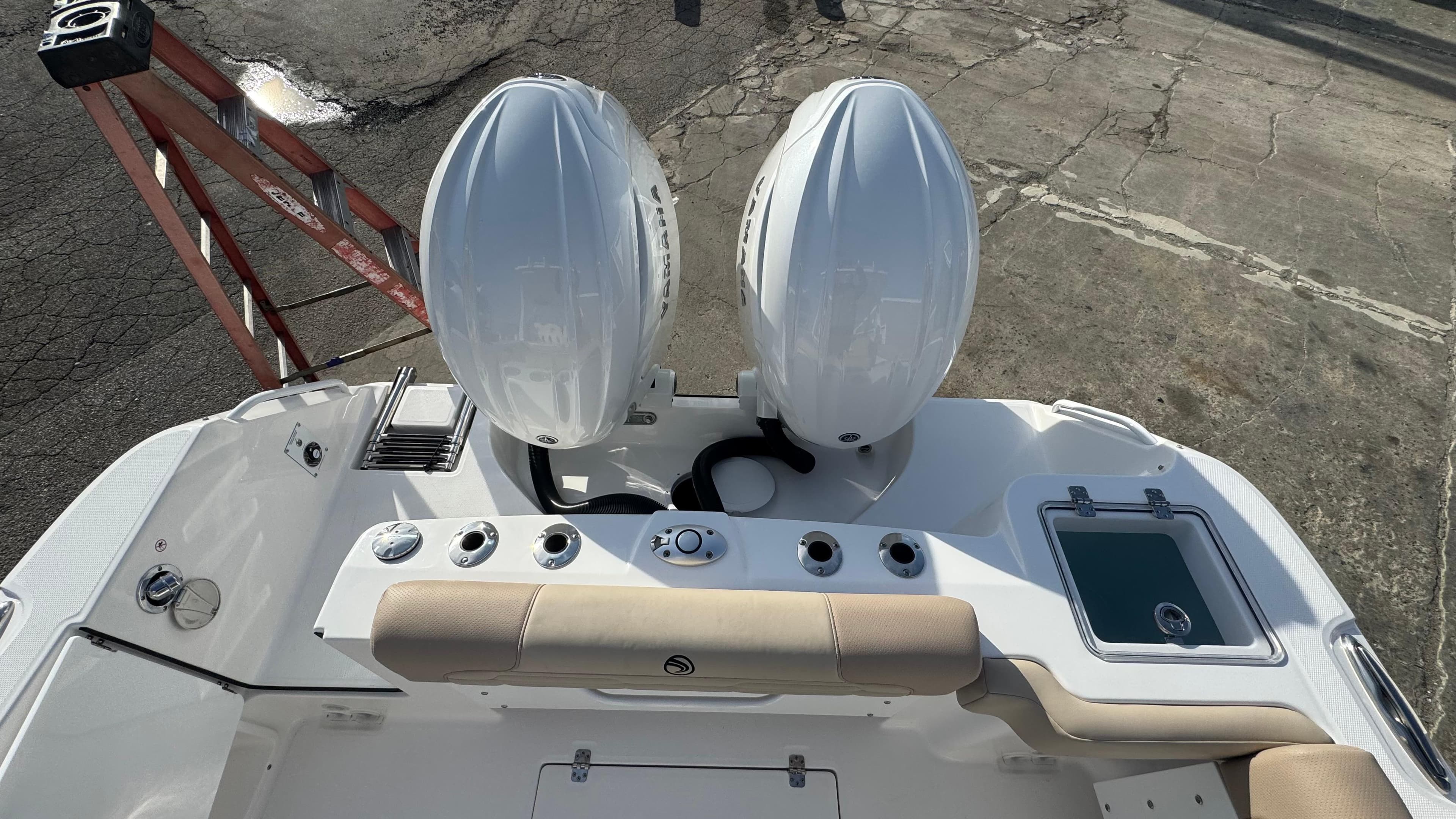 2025 Edgewater 262CX boat with dual outboard engines, viewed from above.