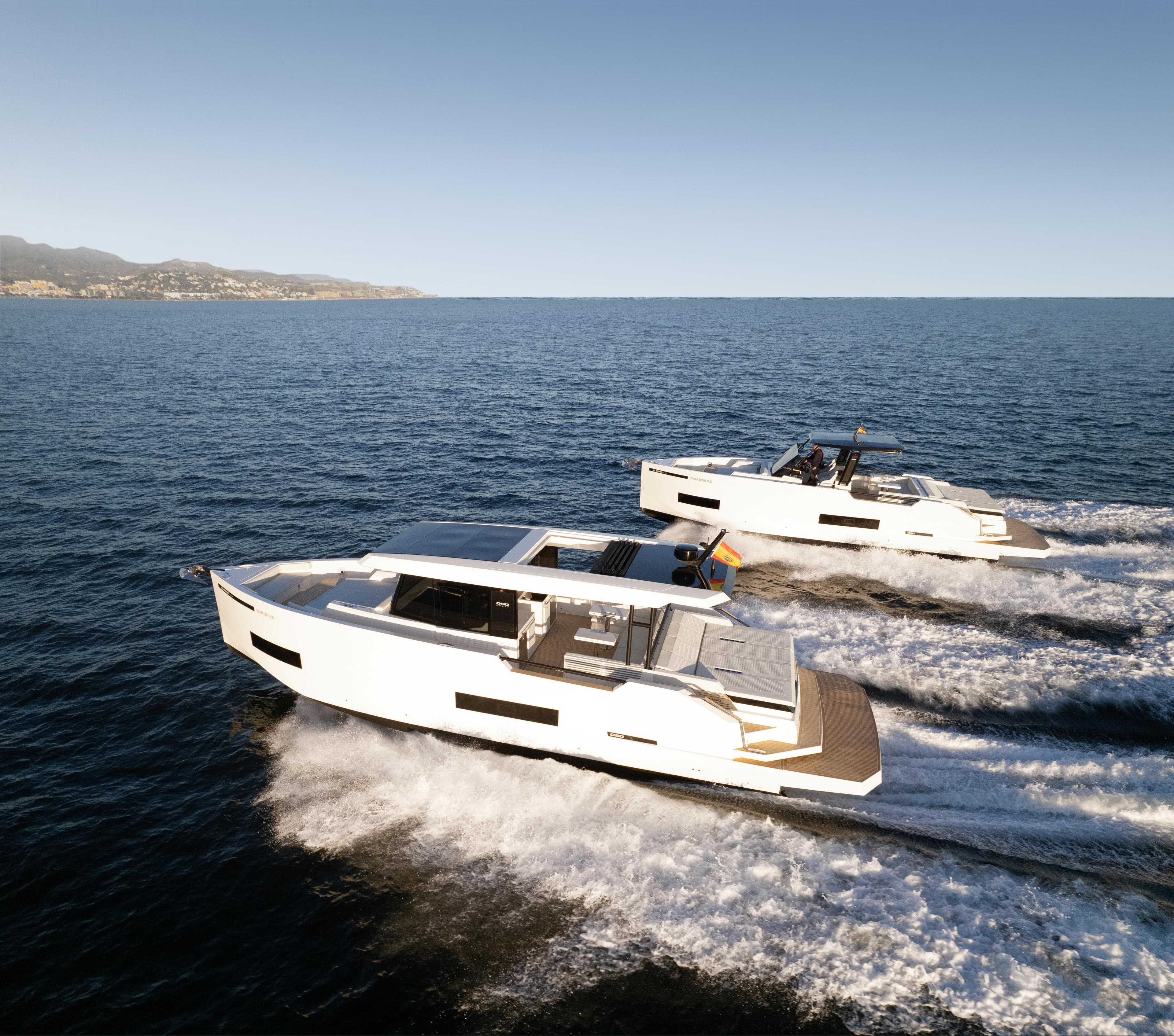 2024 De Antonio Yachts D50 Coupé cruising on open sea, showcasing sleek design and performance.