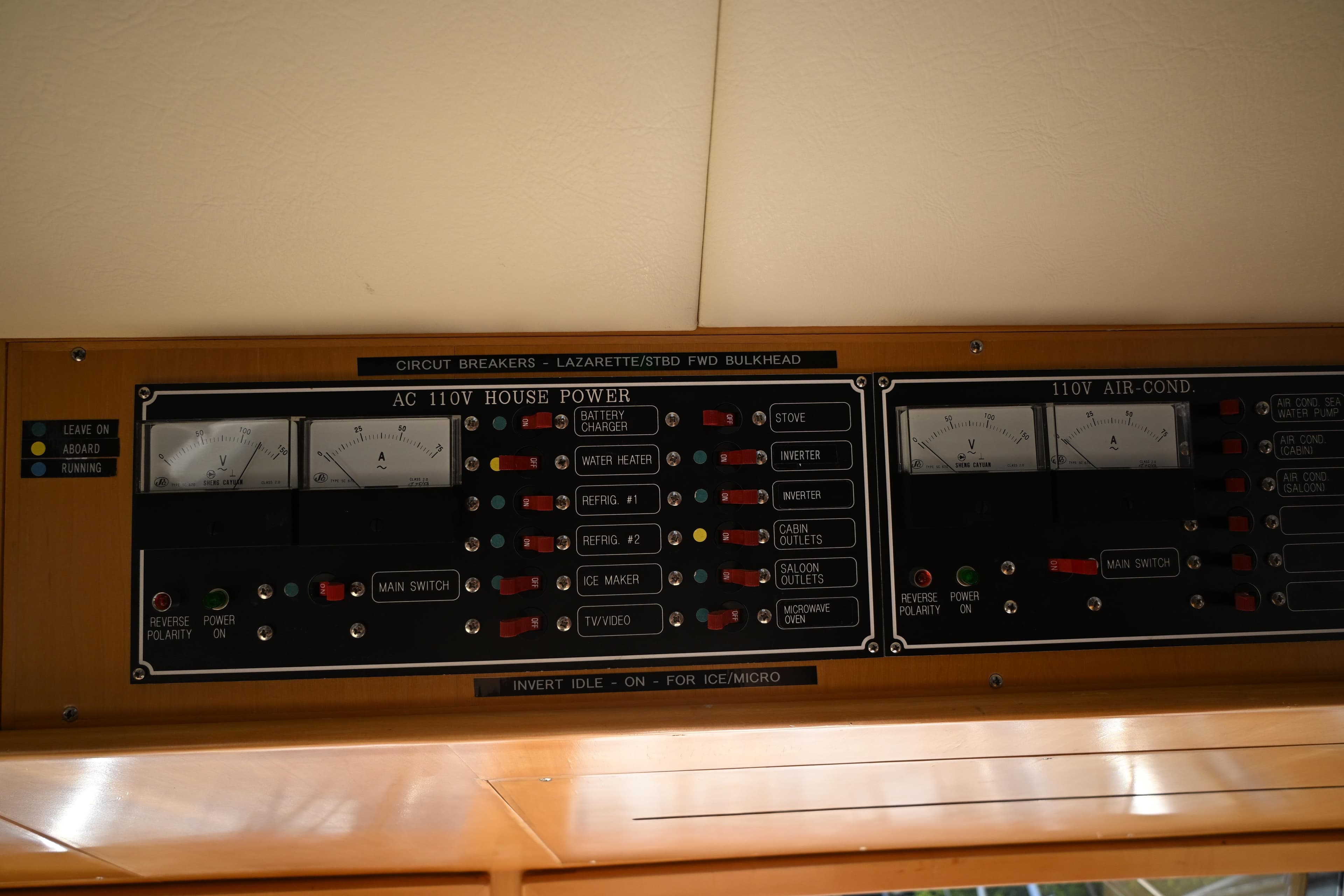 Electrical panel on a 1999 McKinna 47 Sedan, featuring AC 110V house power controls.