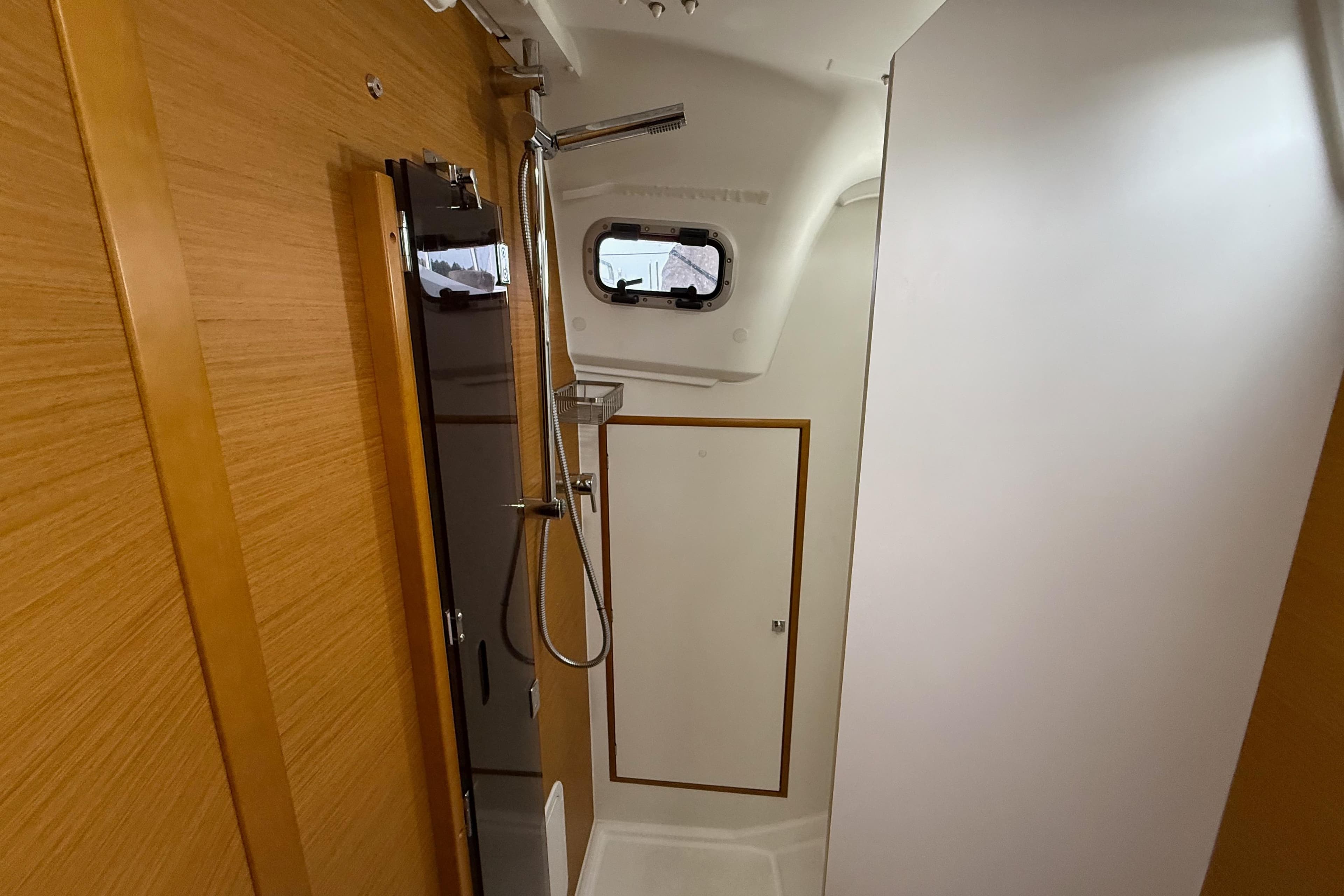 Interior of 2016 Jeanneau Sun Odyssey 349 yacht bathroom with shower.