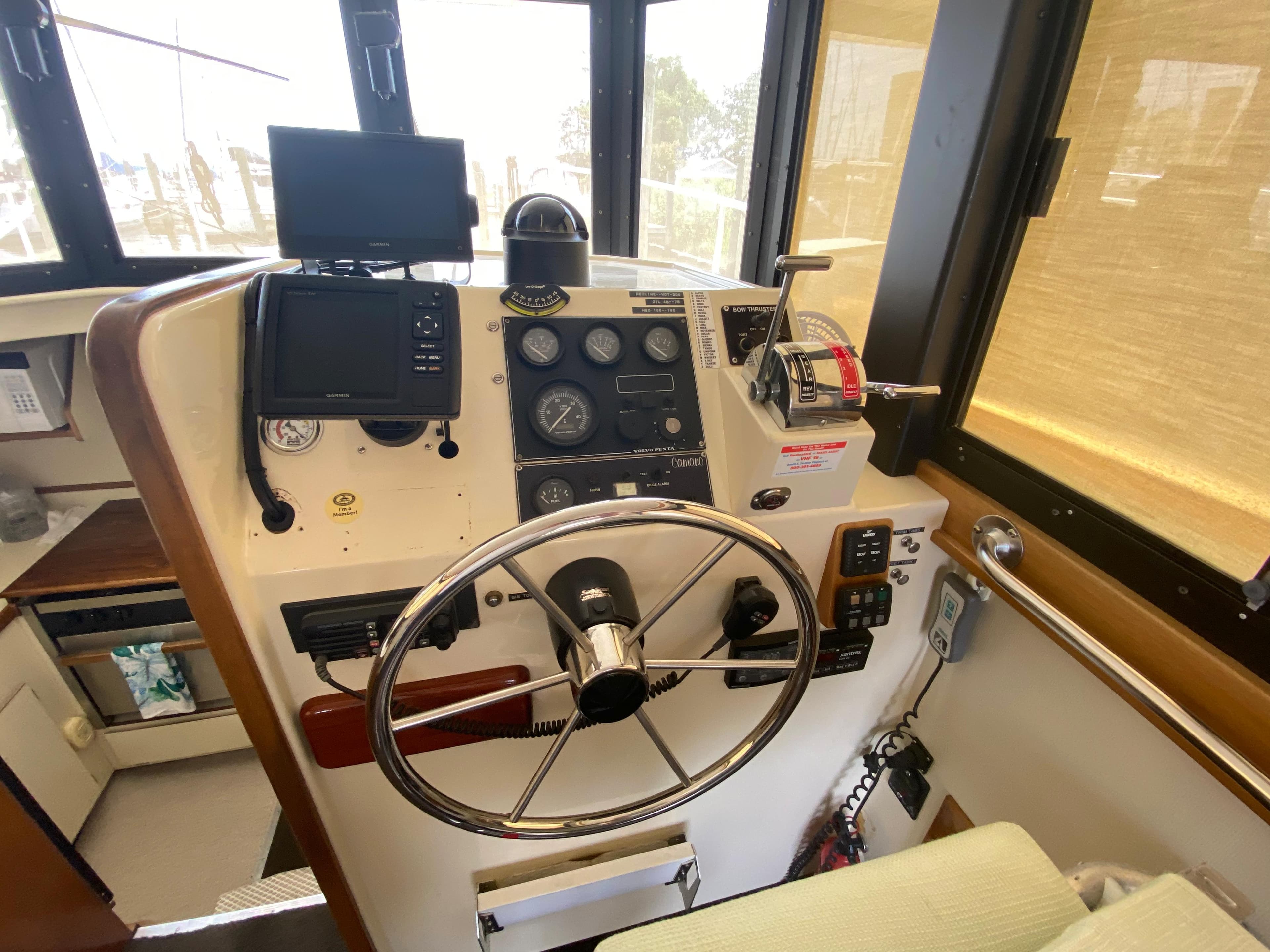 1998 Camano Troll 31 boat helm with steering wheel and navigation instruments.