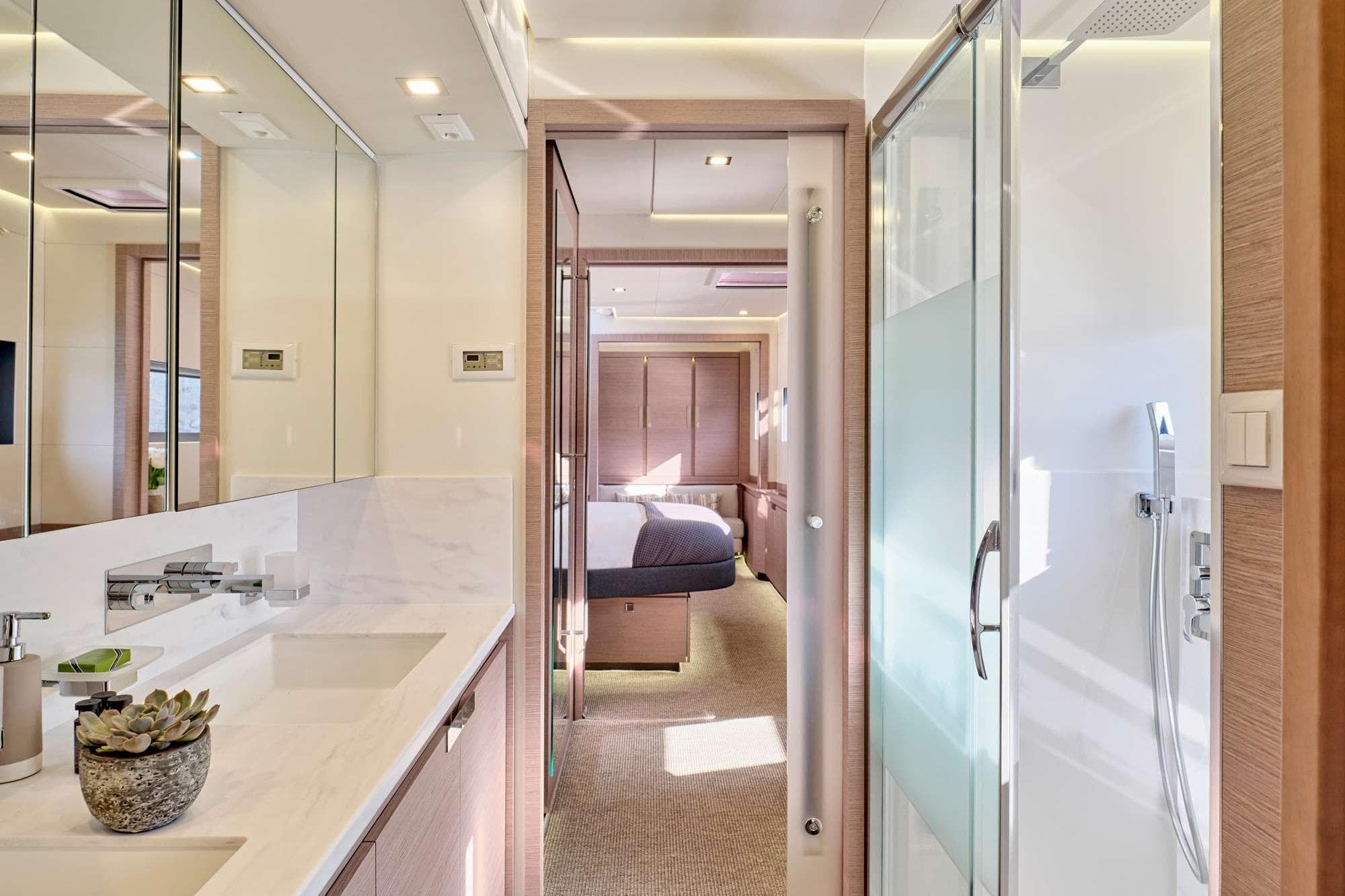 Luxurious bathroom interior of 2023 Fountaine Pajot Power 67 yacht, featuring modern fixtures and elegant design.
